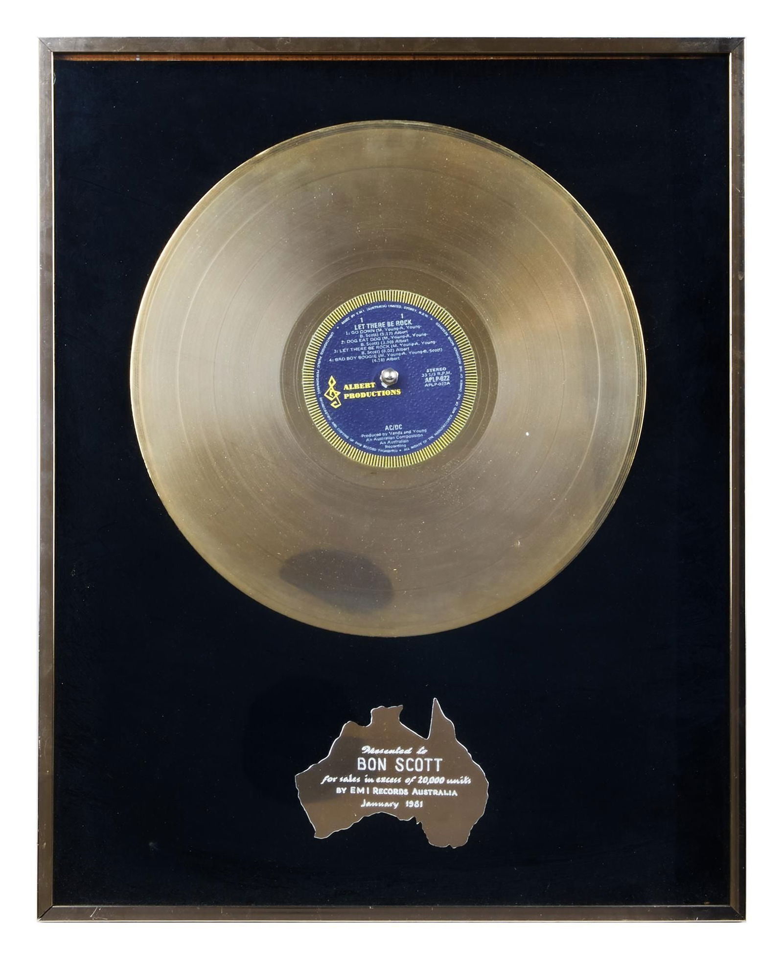 AC/DC | Bon Scott Australian "Gold" Record Award for "Let There Be Rock": An Australian in-house "gold" record award for "Let There Be Rock" featuring a metal plaque in the shape of a map of Australia wih inscription "Presented to / BON SCOTT / for sales in excess of 20,000