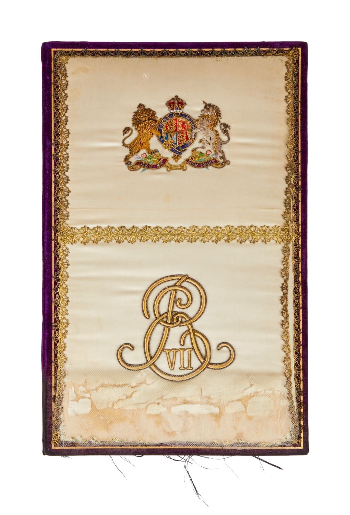 King Edward VII | Royal Cipher Blotter Book: A cream-colored satin blotter book with purple velvet back and lined and trimmed with purple watered silk and that has been embroidered with King Edward VII's cipher. The book features several blank p