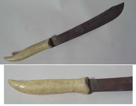 King Kong (1933) Native Machete Used In Film: Native machete used in "King Kong", RKO, 1933. Fourteen inch steel blade with a wooden, ivory-colored handle. Overall length is 21 1/2". FROM THE COLLECTION OF FORREST J ACKERMAN. CONDITION: Blade has