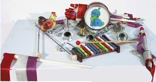 Blackstone Magic Show: Toy Instruments: This lot contains two silver batons, a metal toy chicken, two toy trumpets, two toy saxophones, a xylophone with stick, a gold recorder, a silver triangle (no stick), a small toy drum (with blue and g
