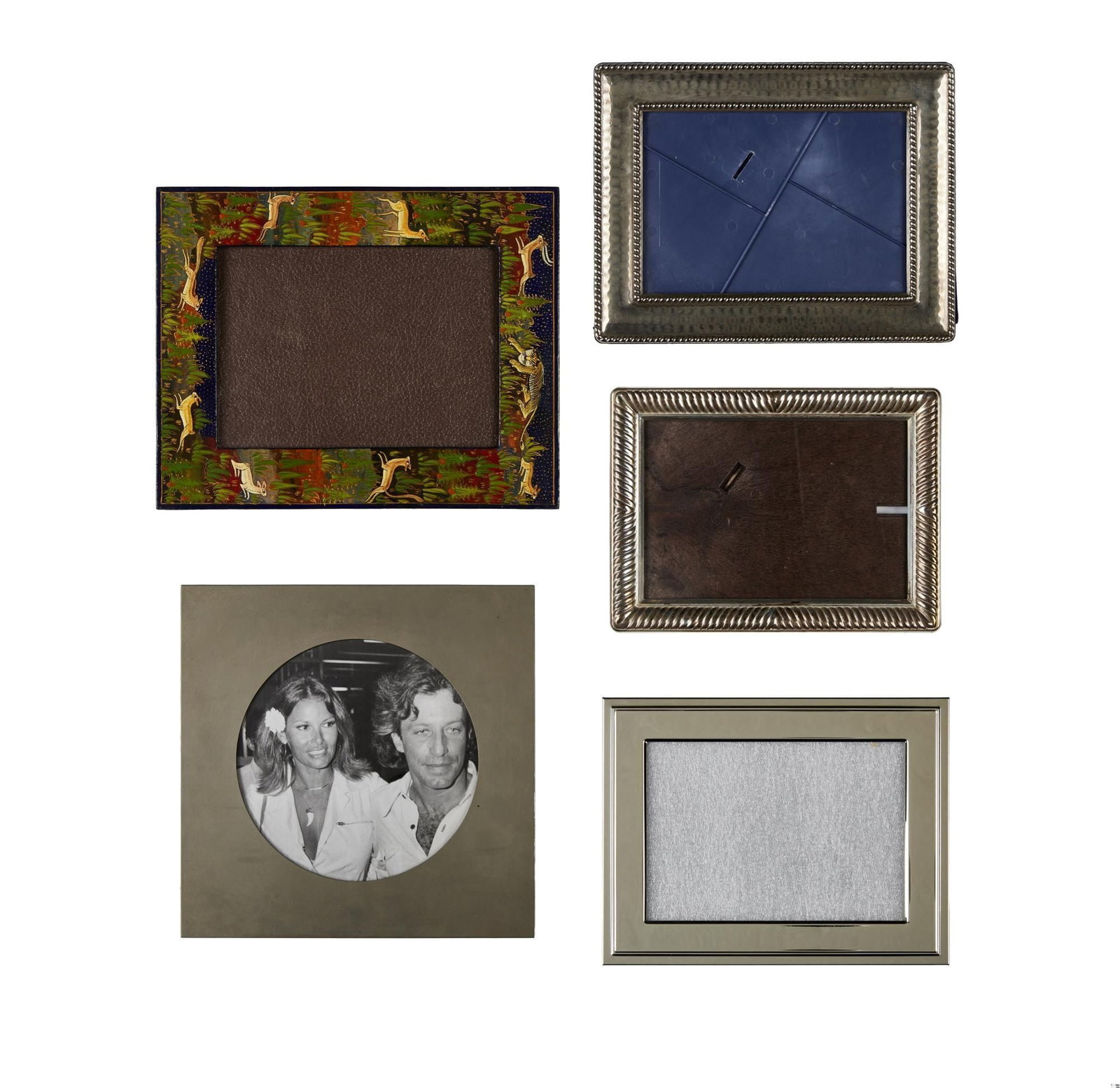 Raquel Welch | Picture Frames: A group of five 5x7 picture frames, including an example marked "WATERFORD"; an example with a circular glass reserve containing a photo of Raquel Welch wearing a horn amulet necklace pendant; a lacqu