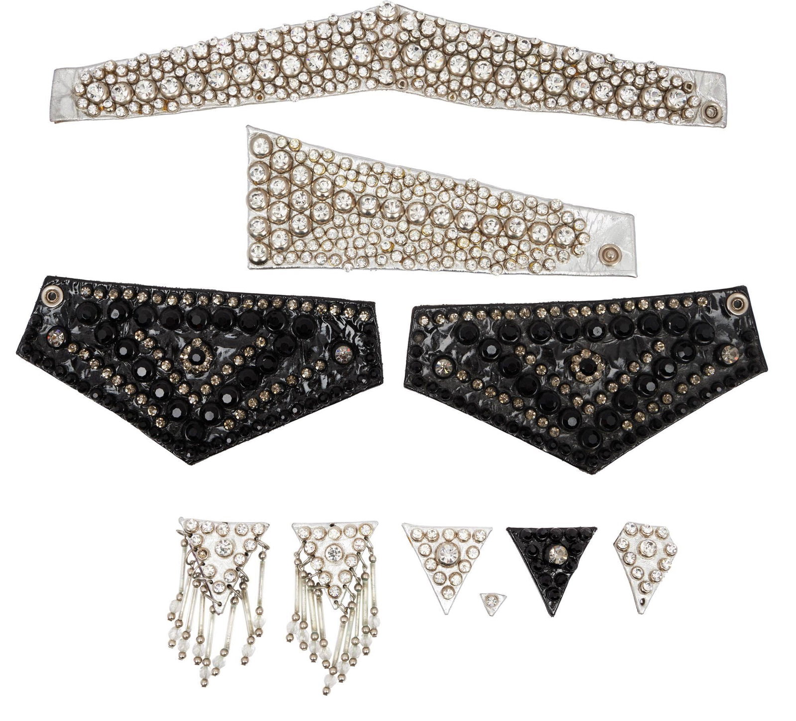 Raquel Welch | Patent Leather And Simulated Diamond Jewelry with Photo: A group of jewelry including a silver patent leather choker with simulated diamond details and a snap button closure; a single silver patent leather cuff bracelet with simulated diamond details and a 