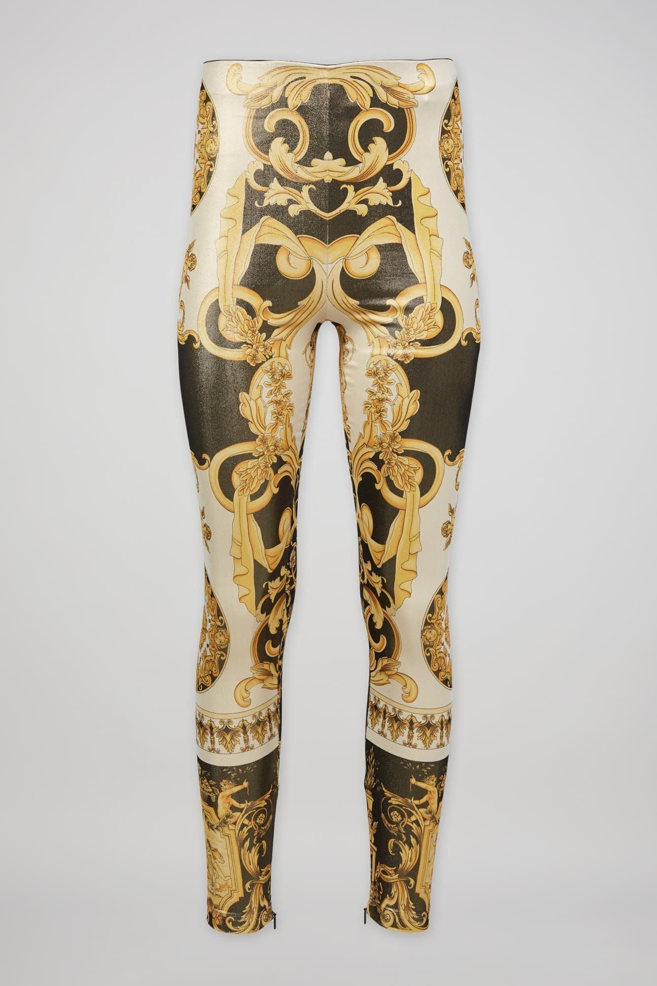 Versace | 2018 Tribute Baroque Print Leggings: Polyamide and elastene blend leggings in shades of metallic gold and black from the 2018 Spring/Summer Tribute collection by Donatella Versace. These pants are a replica of the same design from the Sp