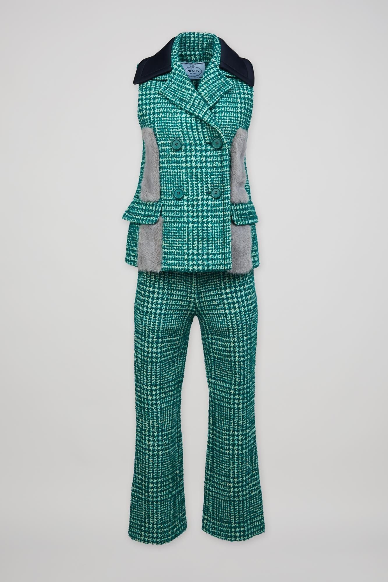 Prada | Fall 2015 Tweed Ensemble with Fur Accents: A Prada green two-piece plaid wool tweed ensemble designed by Miuccia Prada for the 2015 fall ready-to-wear collection. The ensemble features a green and blue plaid double-breasted vest with a notch l