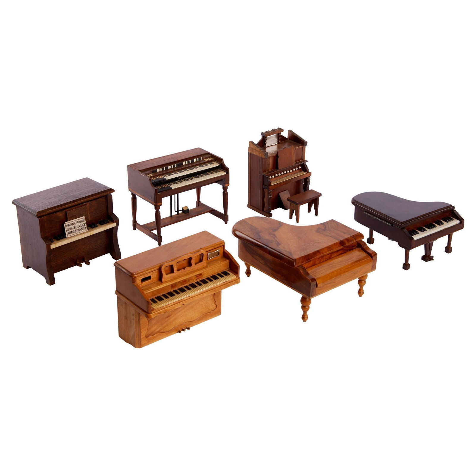 Christine McVie | Collection of Six Brown Piano Boxes: A group of wood piano or organ music or trinket boxes, one is a coaster set. Largest, 5 x 6.5 x 8.5 inches PROVENANCE: Property From The Life And Career of Christine McVie Memorabilia, Decorative Arts