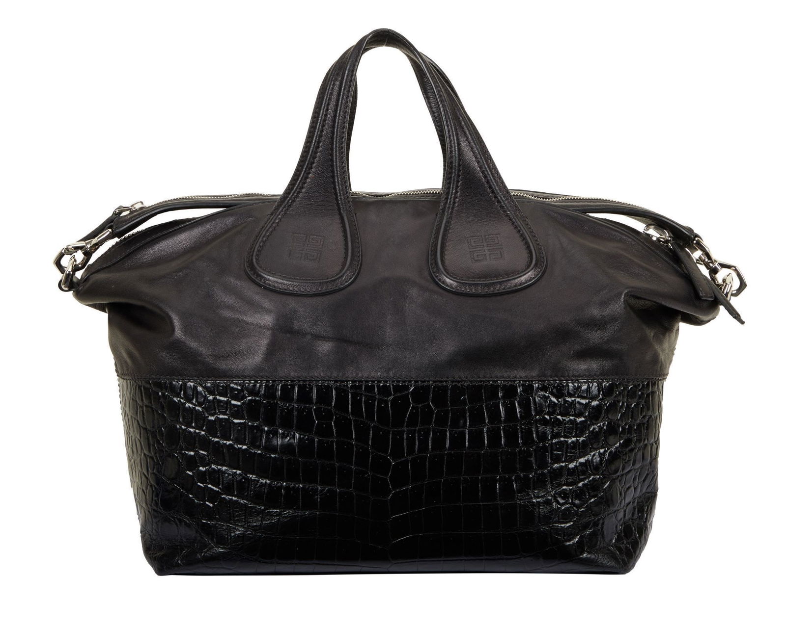 Christine McVie | Givenchy Crocodile Nightingale Bag: A Givenchy Crocodile stamped calfskin medium nightingale bag in black featuring a strap and top handles, silver-tone hardware, and a black fabric interior with a zipper and additional pockets. Approx.