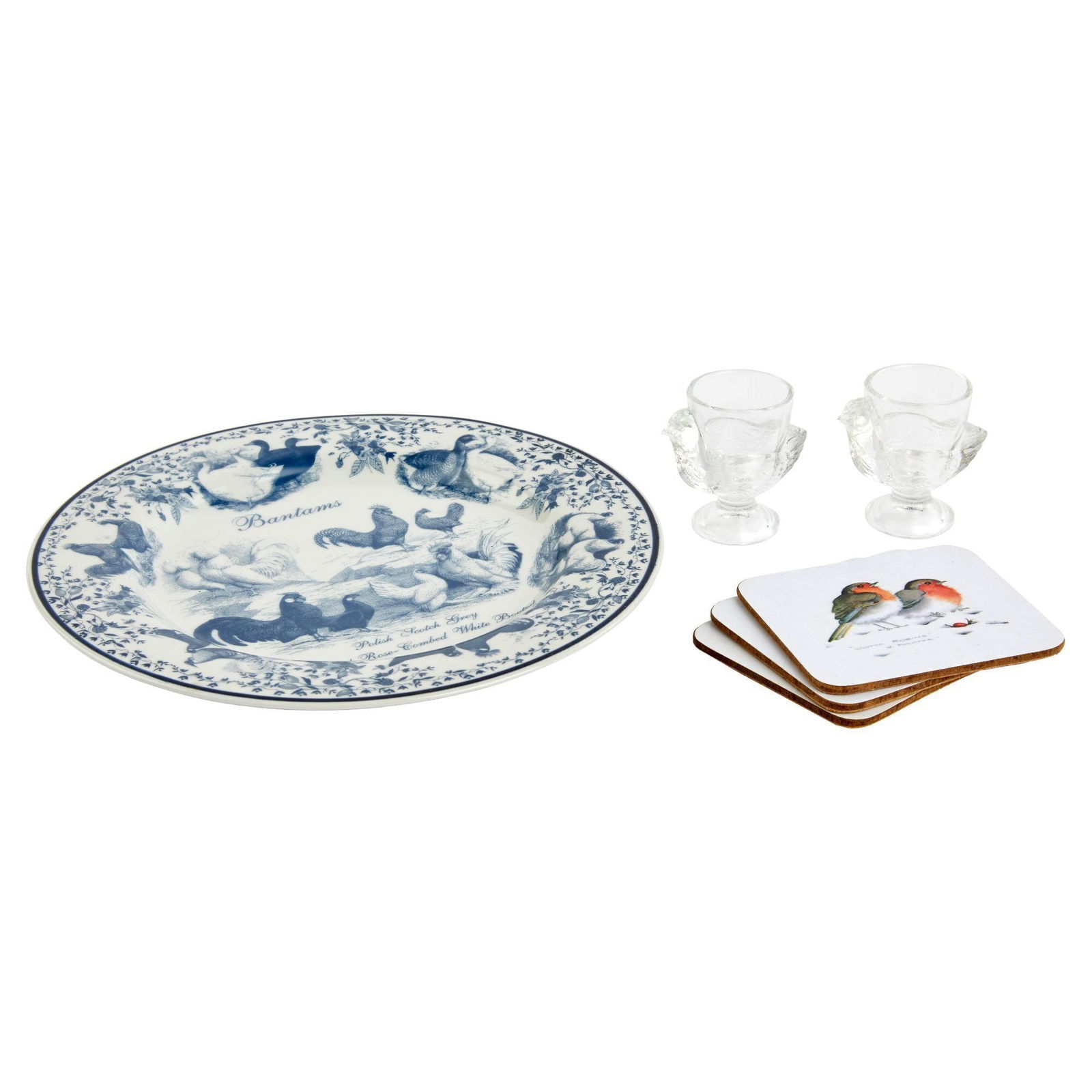 Christine McVie | Group of Bird Themed Tableware: Including a blue and white transferware Norfolk China "Bantams" plate; a pair of colorless glass chicken egg cups, and a set of three Winter Robins cork bottom coasters. Plate, 10.5 inches PROVENANCE: