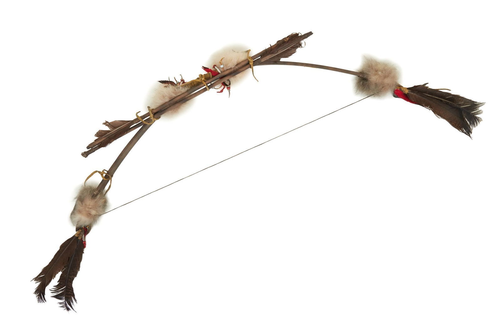 Burt Reynolds | Native American-Style Bow and Arrows: A decorative wooden bow adorned with bird feathers, animal fur, beads, fabric, and leather in the style of a Native American weapon. Accompanied by two wooden arrows with feathered ends bound to the b