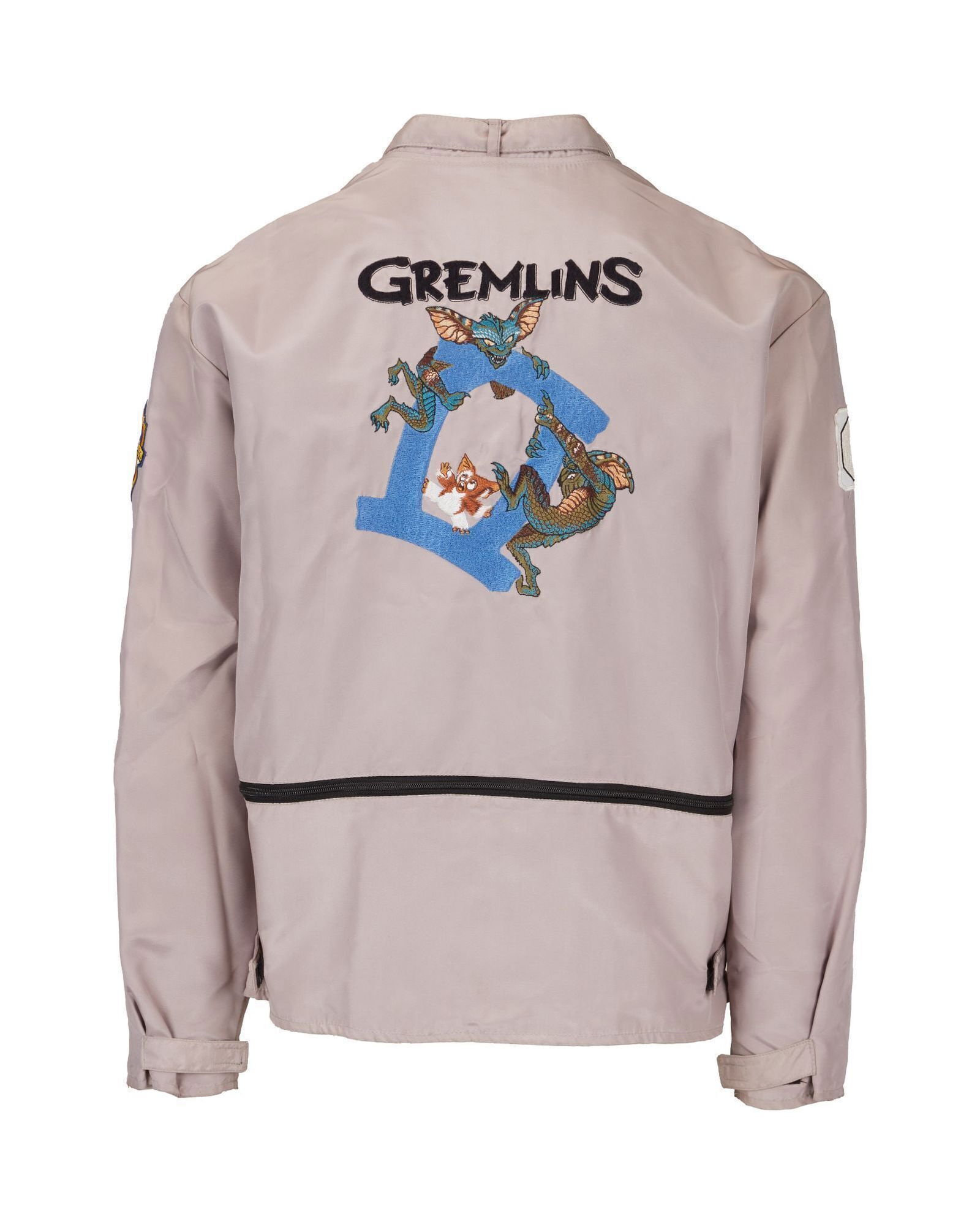 Gremlins 2: The New Batch | Original Crew Jacket: An original crew jacket from the production of Gremlins 2: The New Batch (Warner Bros., 1990) with embroidered gremlin and Gizmo characters on the verso, a Warner Brothers patch on the left arm, and a