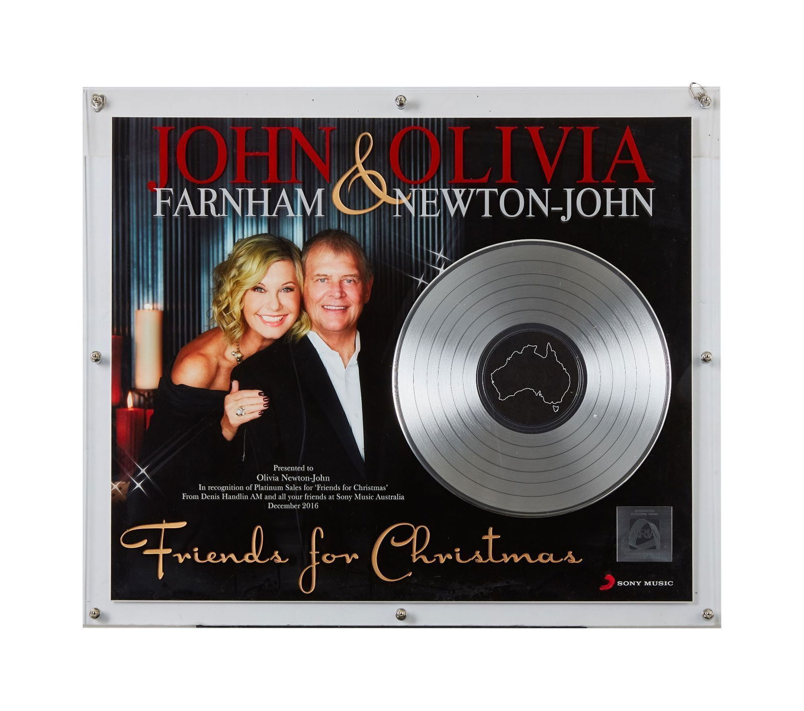 Olivia Newton-John | ARIA Platinum Record Award for "Friends for Christmas": A piece presented to the star by Sony Music Australia for the platinum sales of her 2016 album with John Farnham; interestingly, the ring Newton-John wears on this album cover is being offered in this
