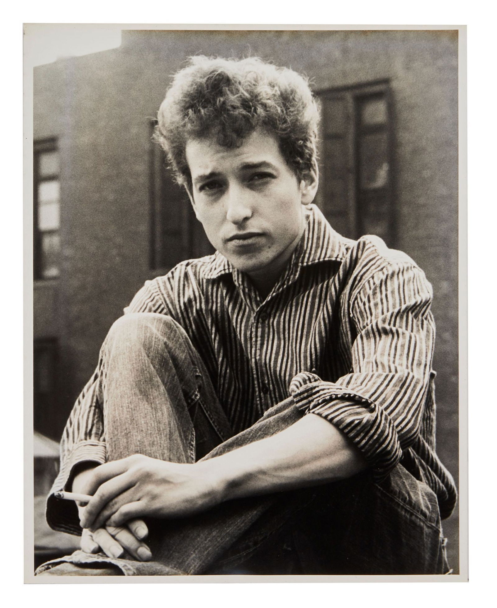 Bob Dylan | Large Vintage Photograph From 1963 Ralph Baxter Session: A vintage 1960s photograph on archival semi gloss photo paper of Bob Dylan in New York City shot by photographer Ralph Baxter. Photographer's stamp on verso reads, "Please Credit / Ralph Baxter / Adve