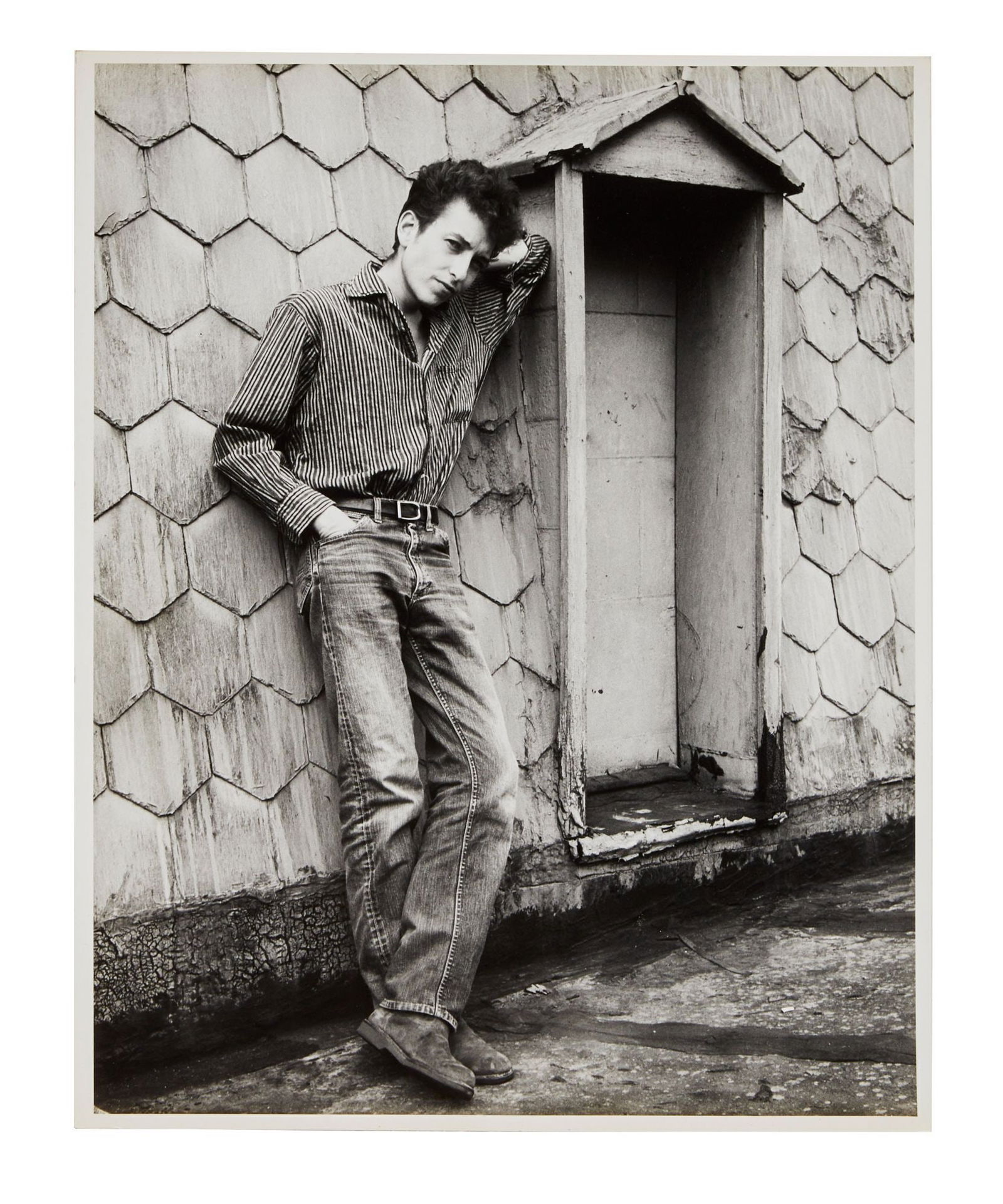 Bob Dylan | Large Vintage Photograph From 1963 Ralph Baxter Session: A vintage 1960s photograph on archival semi gloss photo paper of Bob Dylan in New York City shot by photographer Ralph Baxter. Photographer's stamp on verso reads, "Please Credit / Ralph Baxter / Adve