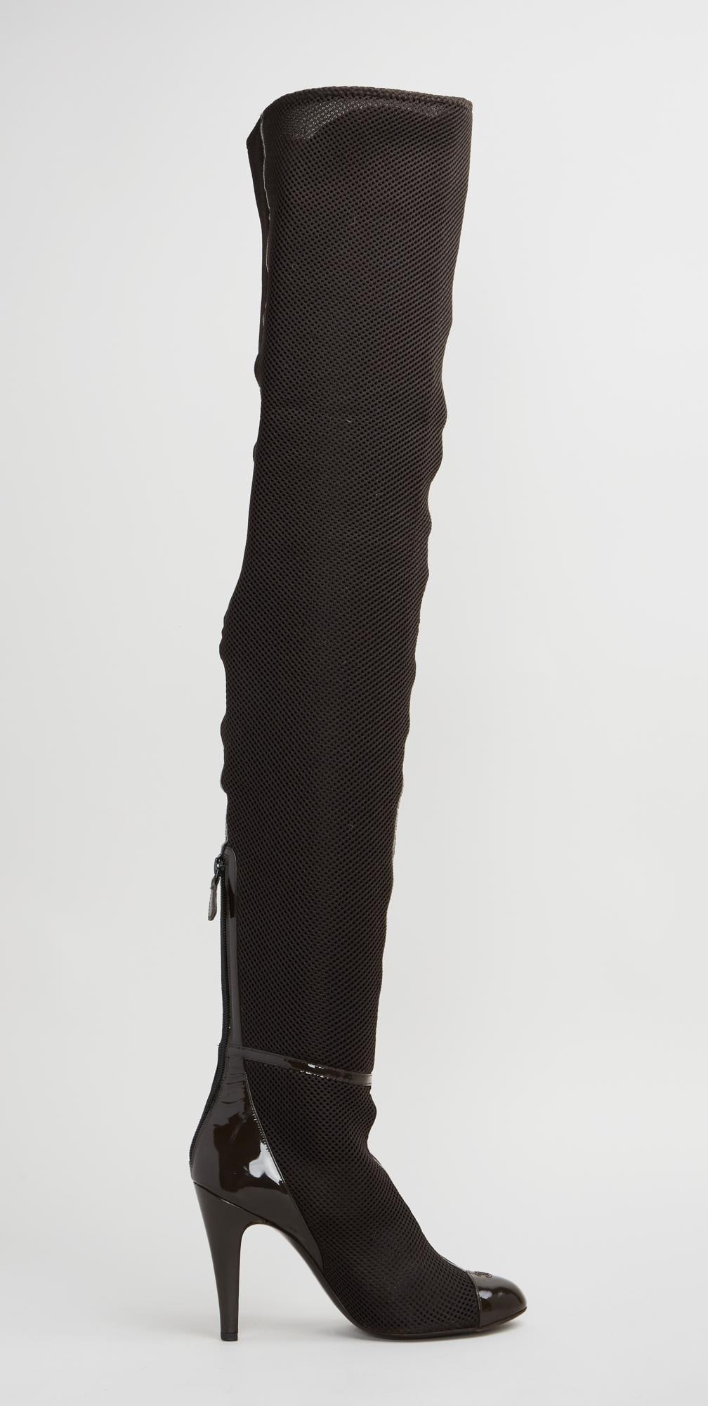 Chanel | Thigh-High Stiletto Boots: A pair of Chanel brown polyester mesh thigh-high boots with brown patent leather toe caps with an embroidered "CC" and matching patent leather stilettos. There is a zip opening at the back o
