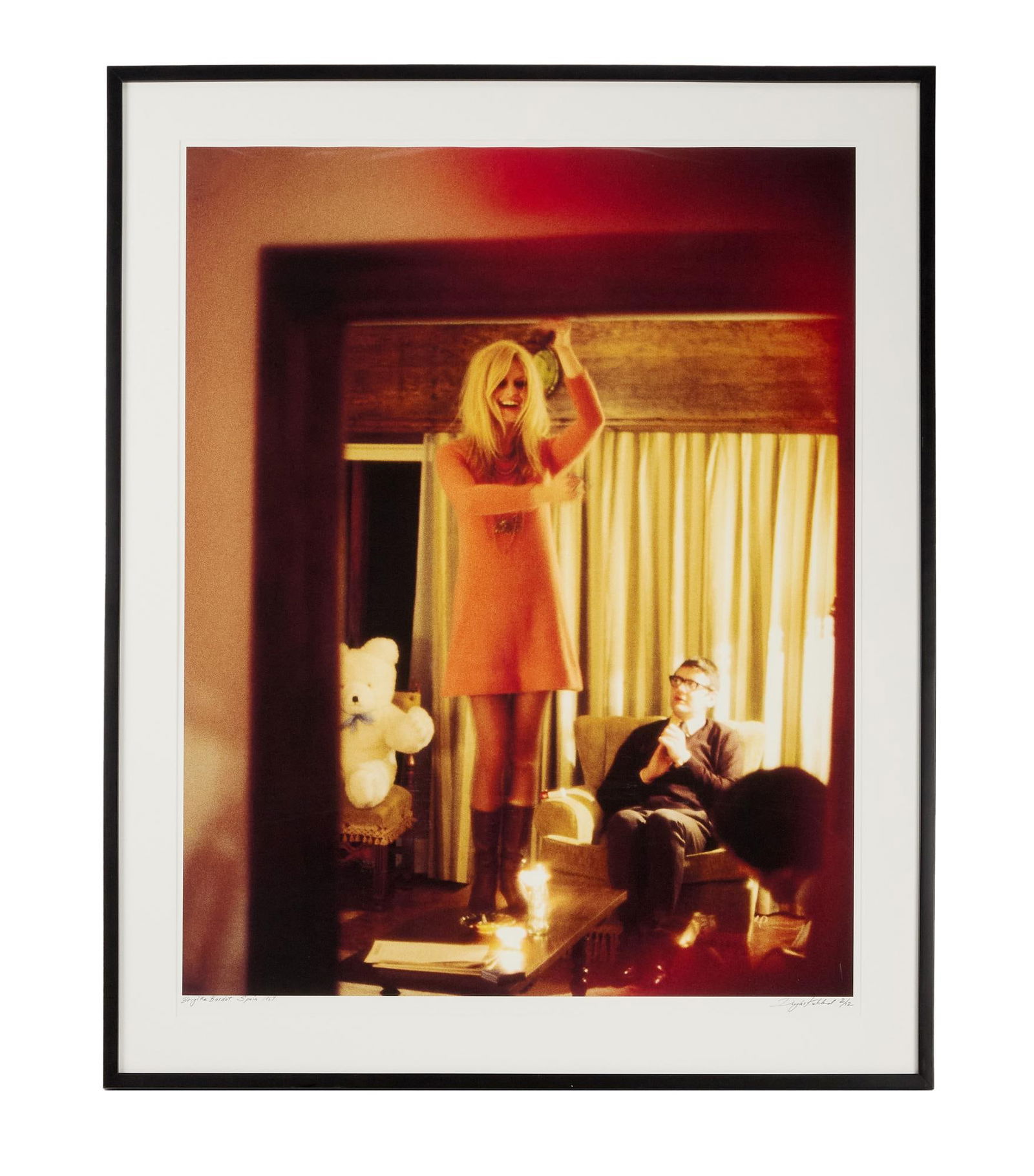 Paul Oakenfold | Brigitte Bardot Photo by Douglas Kirkland: Douglas Kirkland (Canadian/American, 1934-2022), color photograph of Brigitte Bardot Dancing on the Table, 1967, printed later, signed and numbered "2/12", framed and matted. Framed, 4