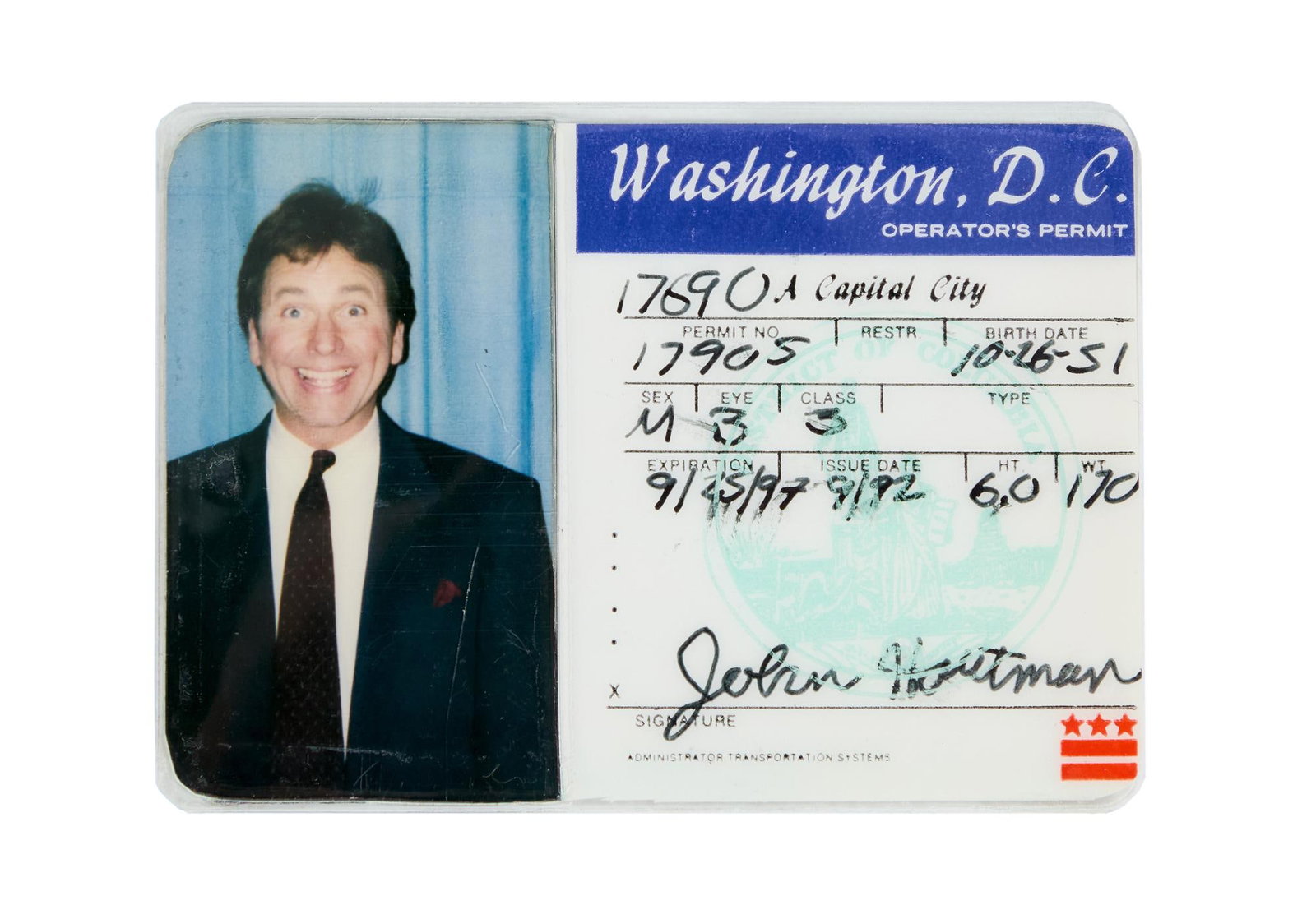 Hearts Afire | John Hartman (John Ritter) Driver's License: A John Hartman (John Ritter) driver's license from the political sitcom Hearts Afire (CBS, 1992-1995). The laminated card features a photo of a grinning Ritter in the role and reads: &qu