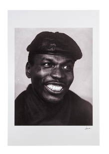 The Julian Lennon Collection | Robert Freeman 1960 Elvin Jones Photo Print: A black and white photo print of jazz drummer Elvin Jones, c. 1960s, taken by photographer Robert Freeman. Signed on the bottom right in silver marker by Freeman. Chromogenic C Type print. Artist prin