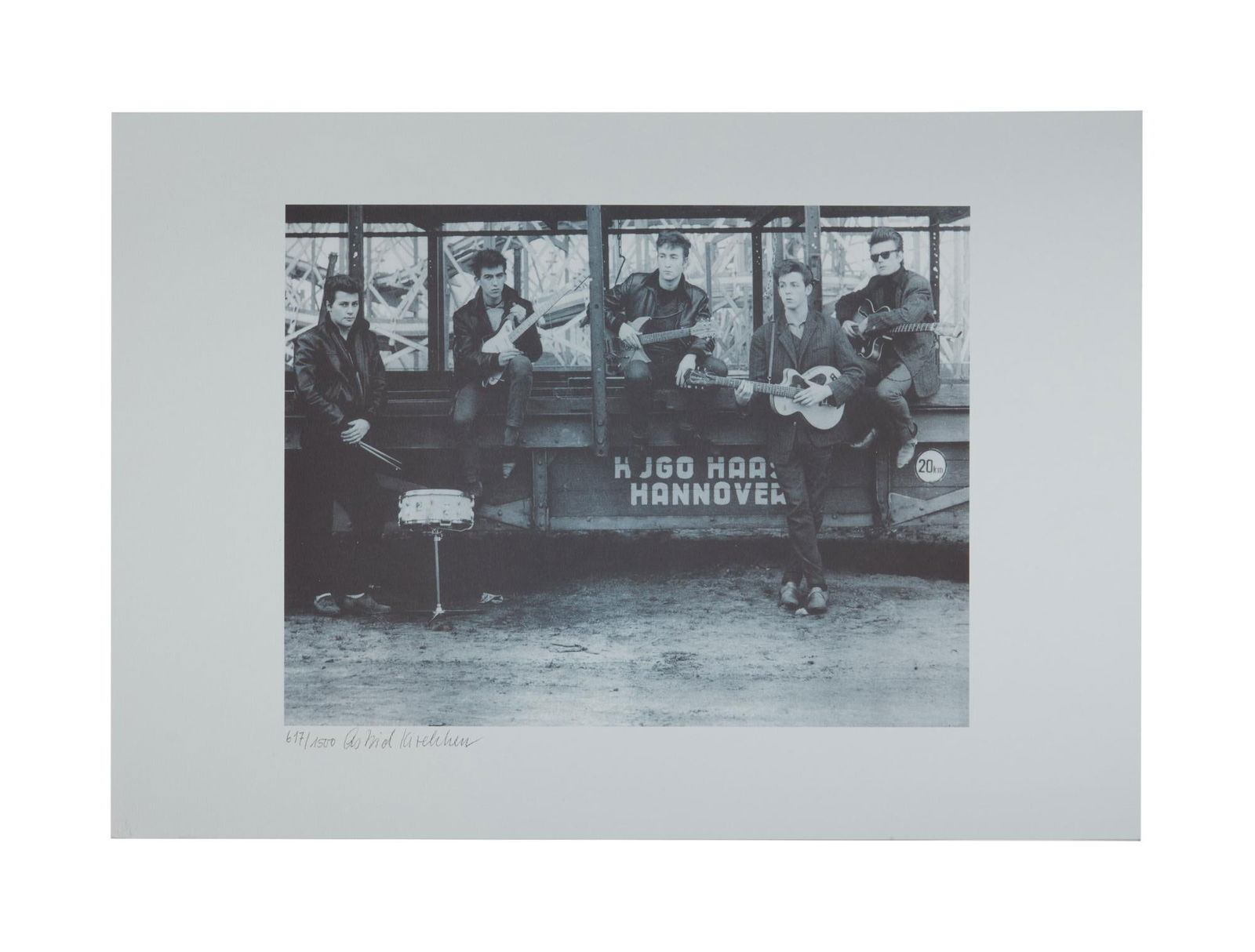 The Beatles | Astrid Kirchherr Signed Limited-Edition Photo Print: A black and white photographic print of The Beatles, taken by the photographer Astrid Kirchherr in November of 1960 at Heiligengeistfeld Square in Hamburg, Germany as part of the band's first photo se