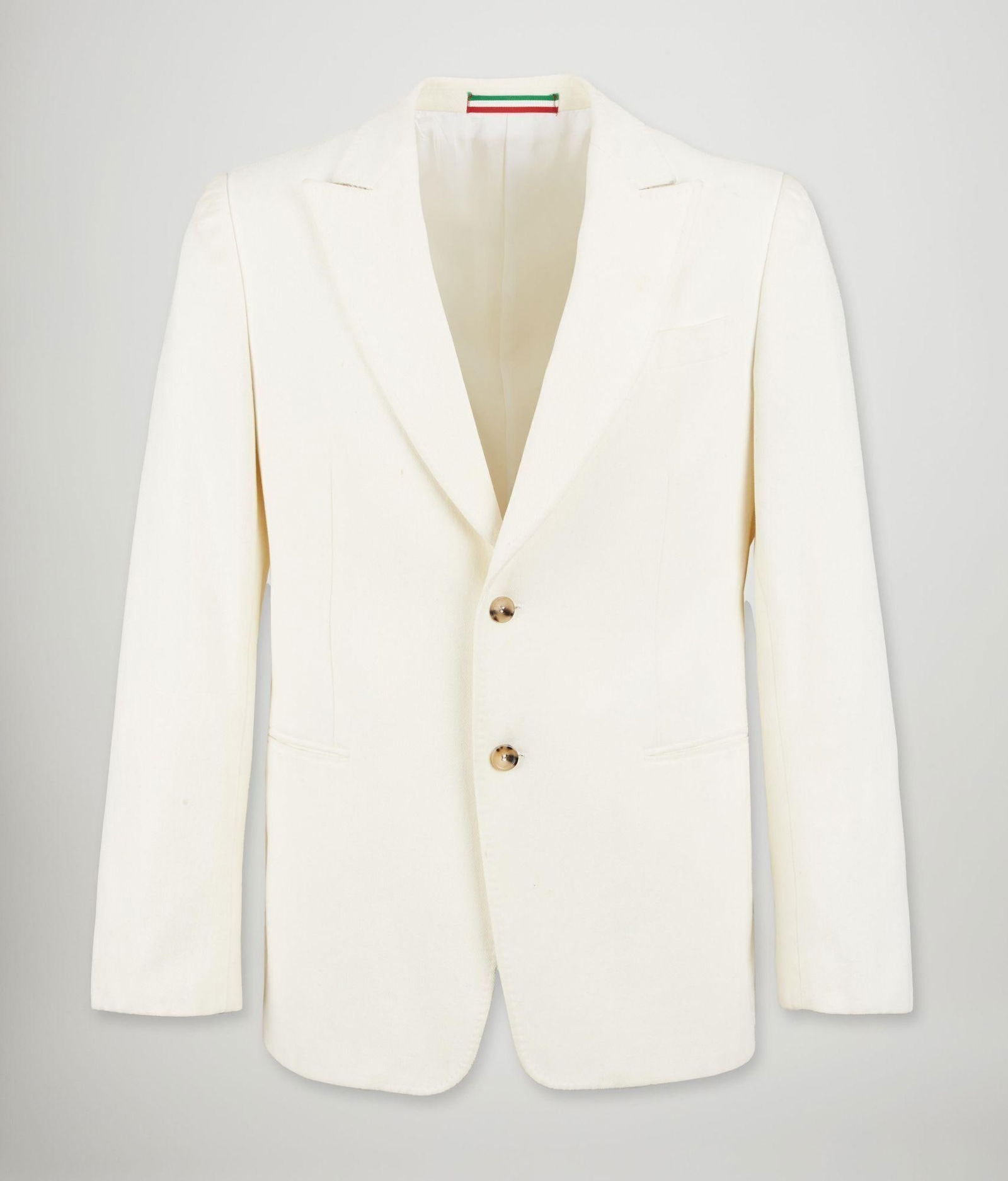 Moschino | 2000s Ivory Cotton Blazer with Peak Collar: Circa 2000s Moschino ivory colored 100% heavy cotton jacket with wide peaked collar. From the era of Rosella Jardini, creative director of the label after Franco Moschino's untimely passing and be