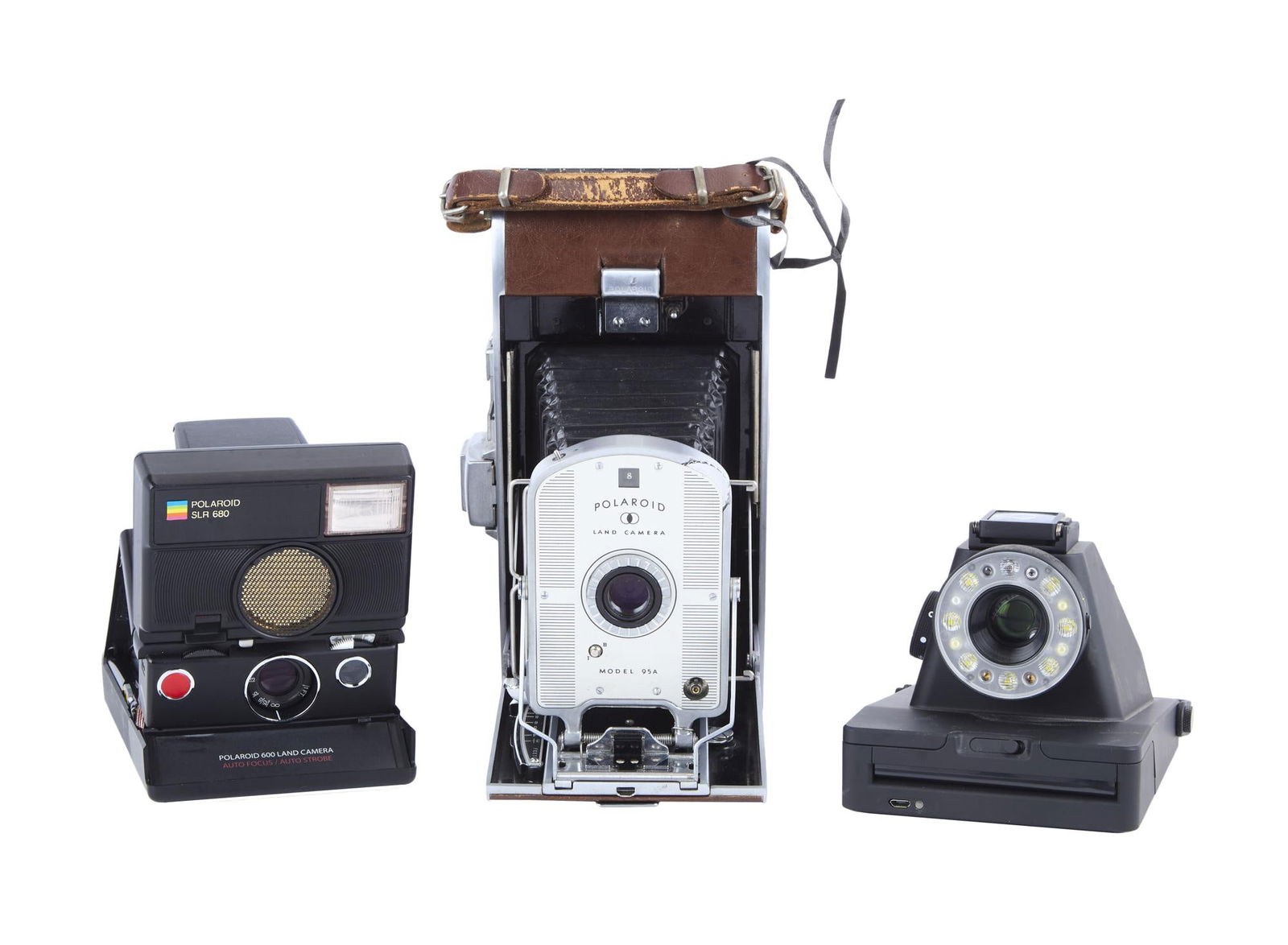 David Lynch | Three Vintage-Style Polaroid Cameras: Three vintage-style Polaroid cameras from the home of David Lynch. Includes: Polaroid Land Camera - Model 95APolaroid SLR 680 - Refurbished Vintage Camera with boxImpossible I-1 Analog Instant Camera
