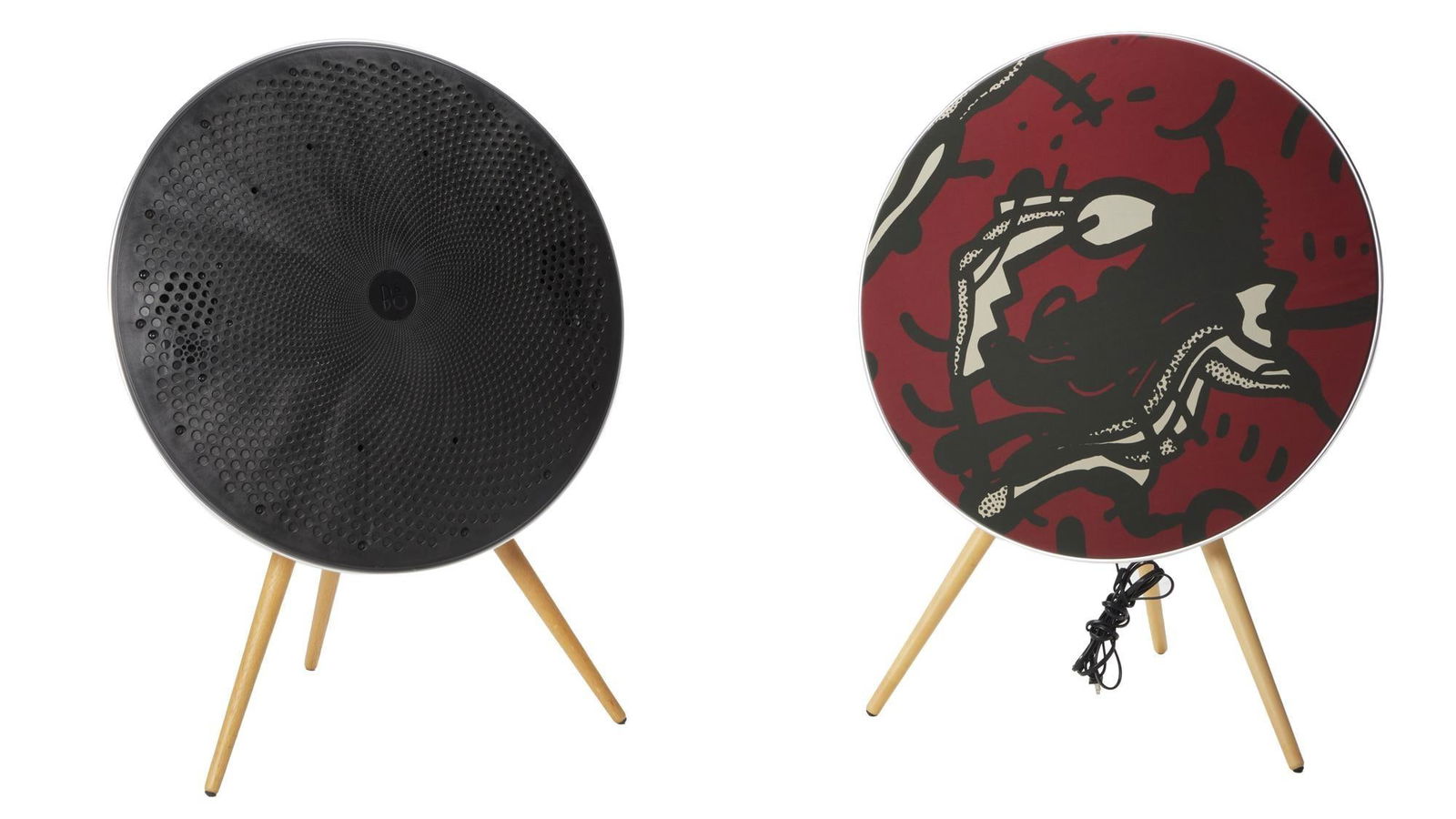 David Lynch | Pair of Bang & Olufsen Beosound A9 Speakers David Lynch Limited Edition: A pair of Bang & Olufsen Beosound A9 speakers in white on light colored wooden legs, one with a limited edition David Lynch cover featuring his “Paris Suite” artwork. The speaker with