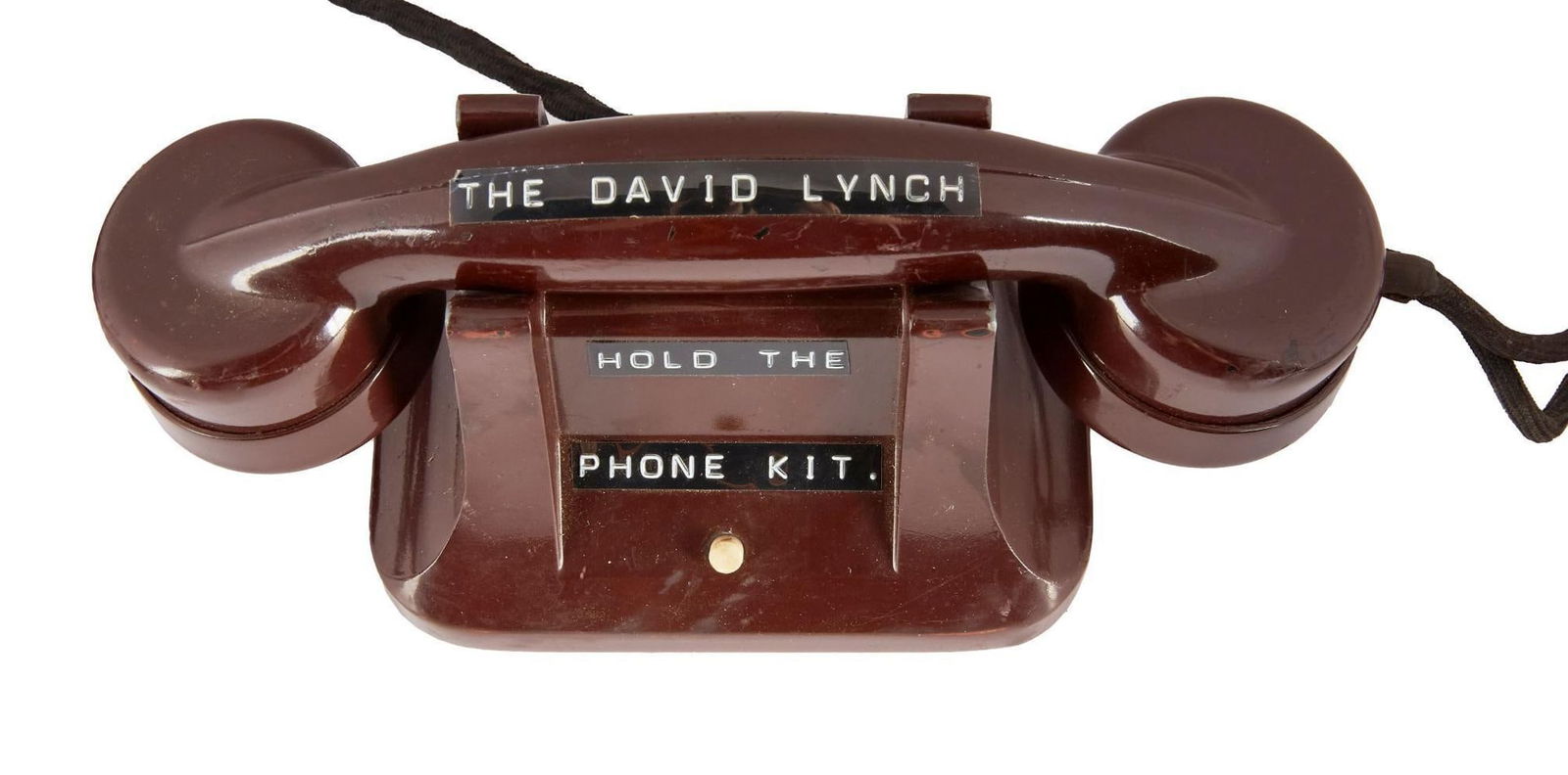 David Lynch | "Dune" Production Office Vintage Telephone: A vintage bakelite intercom telephone, affixed with Dymo labels that read, "The David Lynch Hold The Phone Kit." This phone has been photo-matched, and can be seen displayed on the windowsil