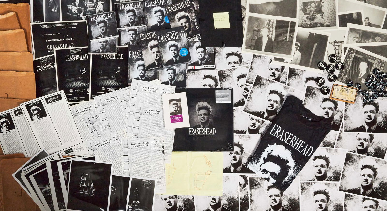 David Lynch | "Eraserhead" Memorabilia Group with Lynch Signed CDs: A group of ephemera and memorabilia relating to David Lynch's first film, Eraserhead (Libra Filns, 1977). Includes: 19 brown paper sleeves containing still black and white photographs (e