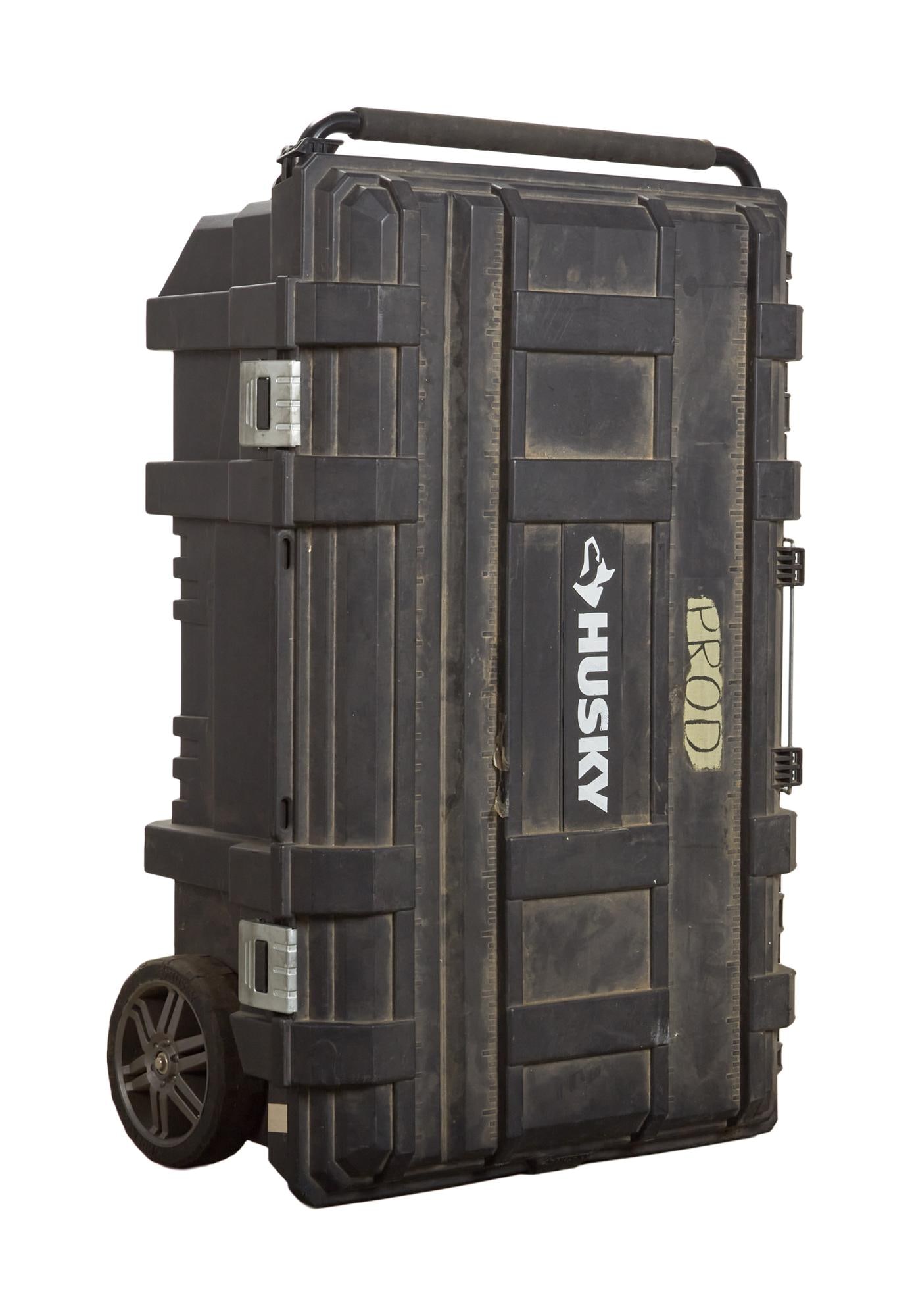 David Lynch | Husky Case with Power Tools: A Husky brand case on wheels, containing numerous power tools including a Milwaukee brand circular saw, a Makita brand grinder, a Makita brand jig saw, and Ryobi brand sander, a DeWalt brand pneumatic