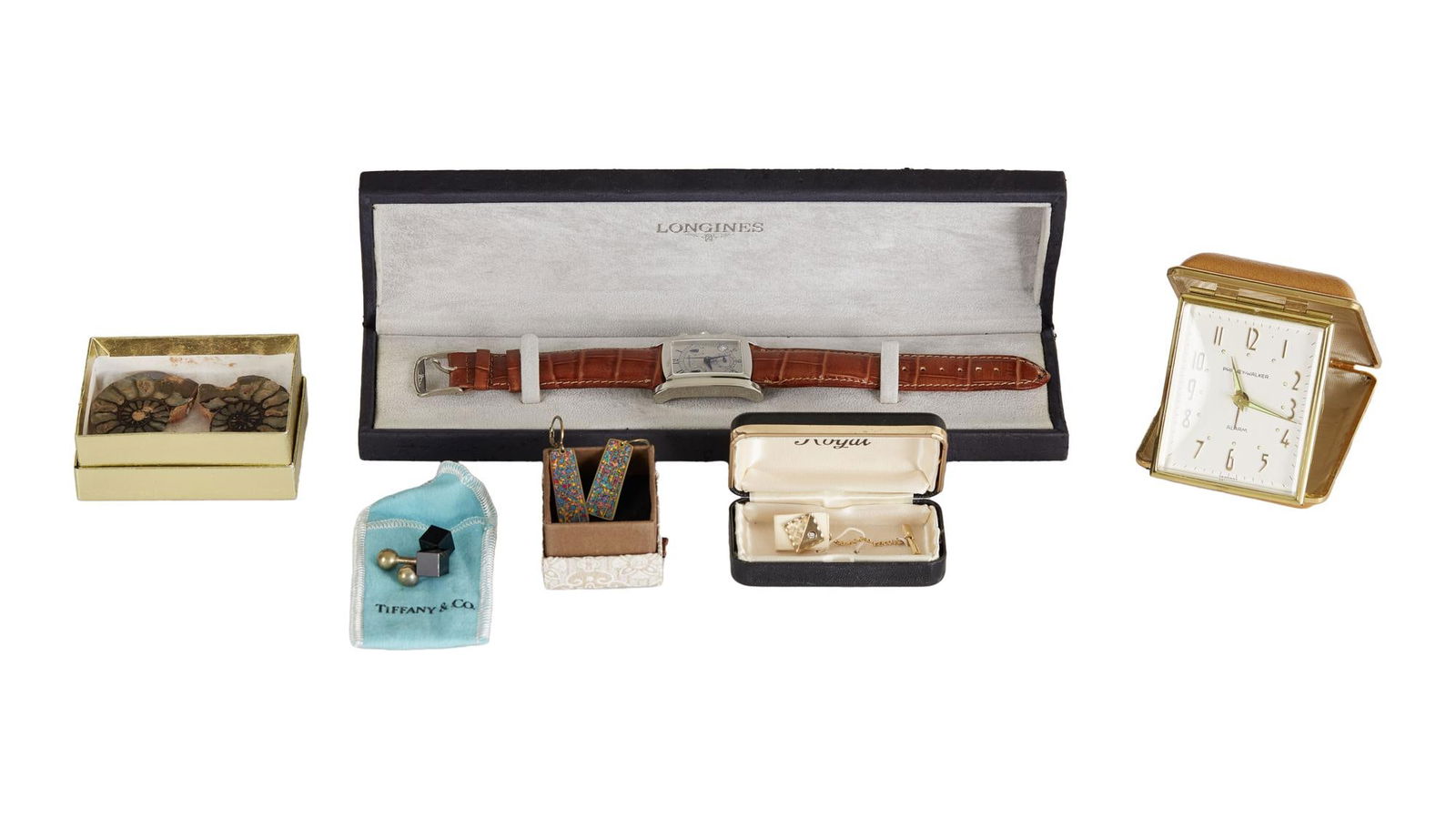 David Lynch | Jewelry Including Tiffany & Co. Cuff Links: A collection of jewelry from the home of David Lynch. Includes a Longines wristwatch, a pair of Tiffany & Co. cuff links, a tuxedo stud, a Phinney-Walker pocket alarm clock, a pair of earrings, an