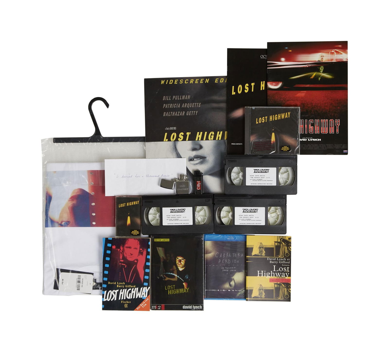 David Lynch | "Lost Highway" Memorabilia: A group of memorabilia relating to David Lynch's neo-noir, Lost Highway (Asymmetrical Productions, 1997). Includes: two lighters; French- and German-language paperback copies of Lynch an