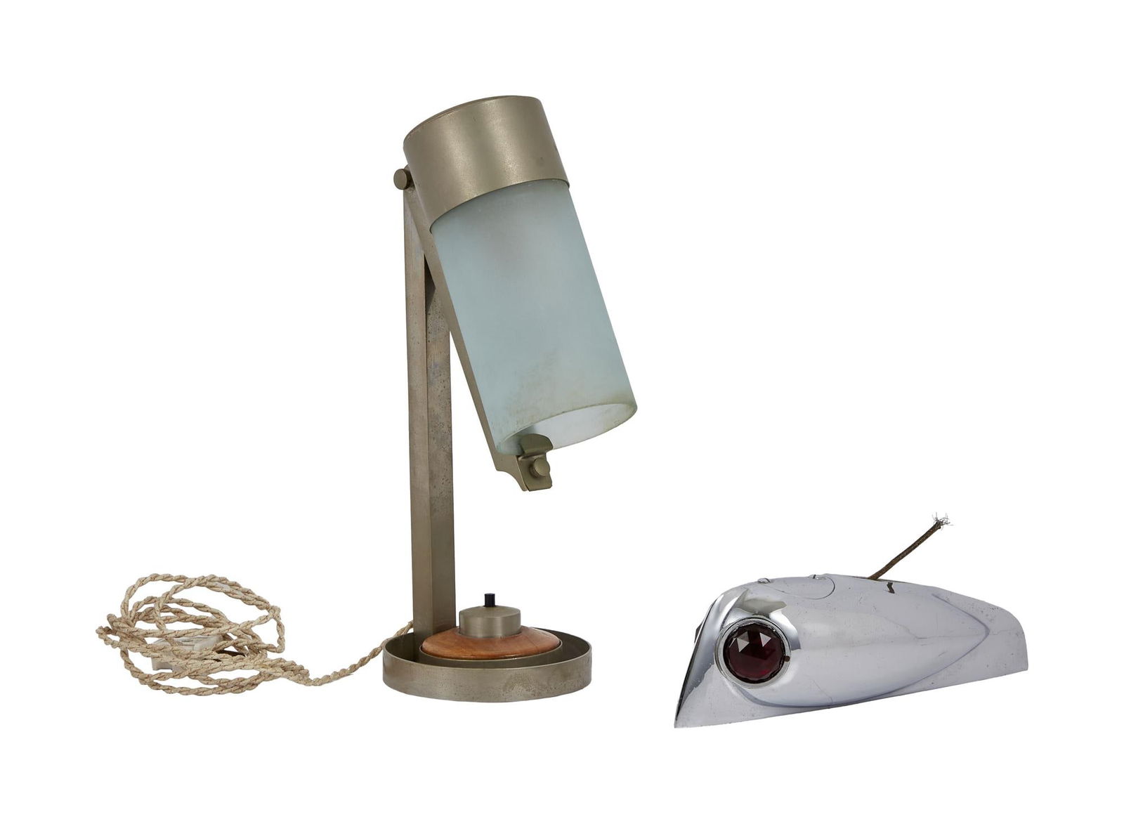 David Lynch | Jean-Boris Lacroix Table Lamp: A vintage Jean-Boris Lacroix table lamp with a cracked glass shade, together with a vintage chrome bow lamp from a boat, and a vintage Chevy-style hood ornament mounted on a wooden display stand. A vi