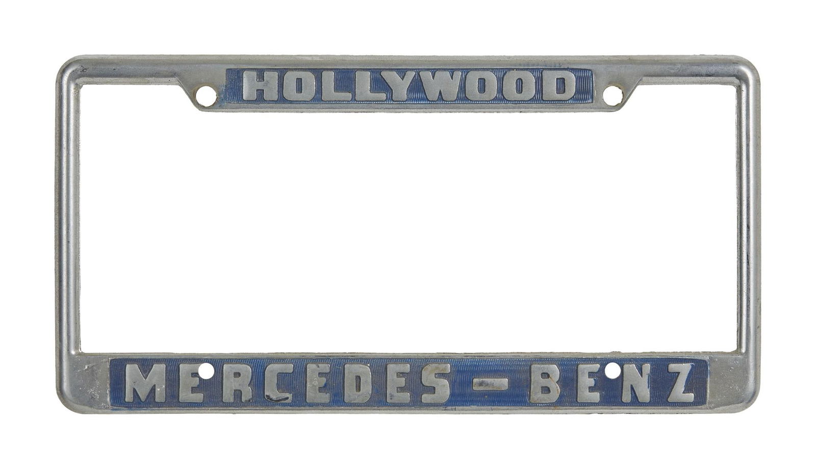David Lynch | Hollywood Mercedes-Benz Metal License Plate Frame: A vintage metal license plate frame that reads "Hollywood / Mercedes-Benz," most likely from the 1970s or 1980s. A vintage metal license plate frame that reads "Hollywood / Mercedes-Ben