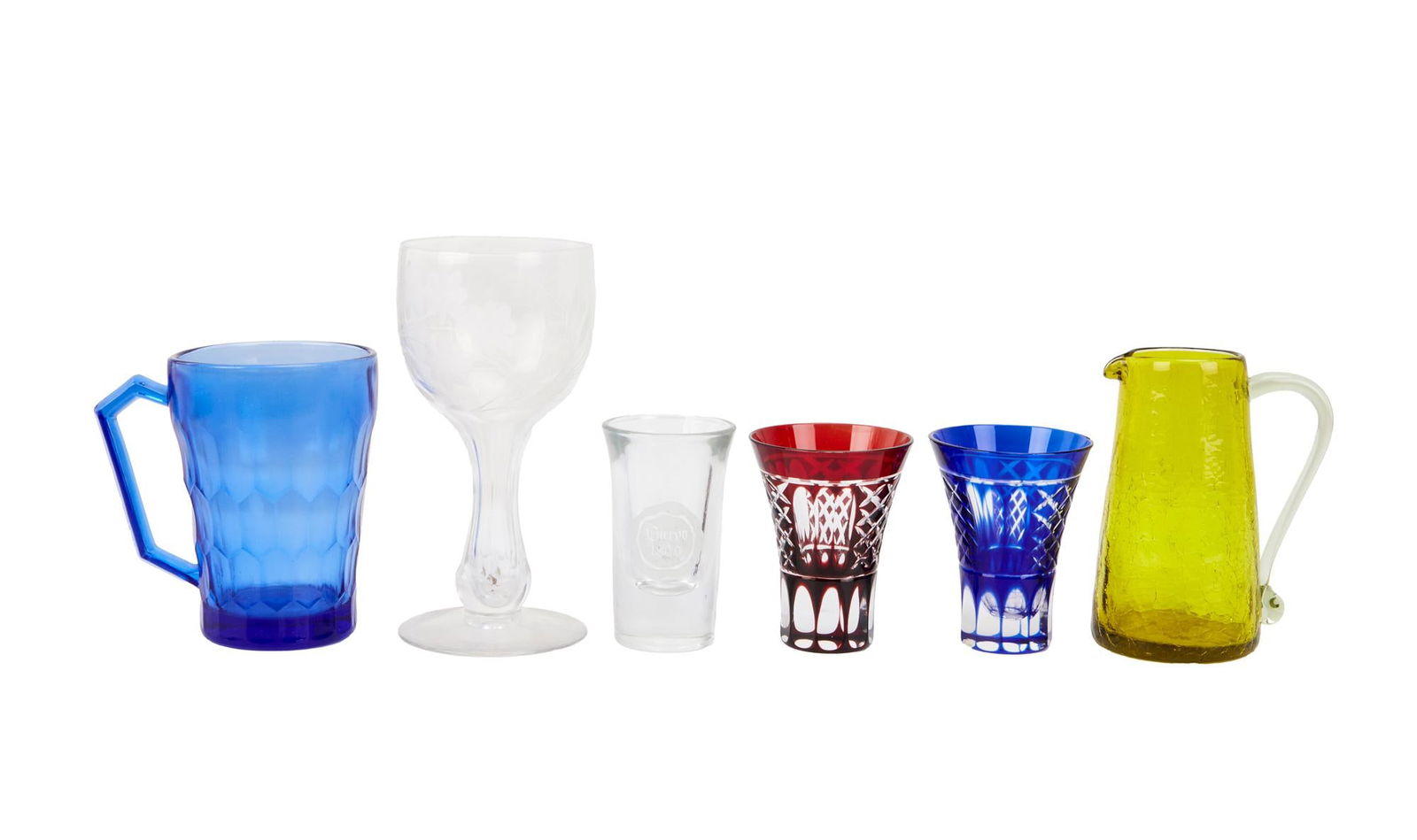 David Lynch | Small Colorful Glassware: A group of six pieces; including a sherry glass, a yellow creamer, a blue mug, a blue Czech glass shot glass, a red Czech glass shot glass, and a shot glass with text reading "Cuervo 1800."