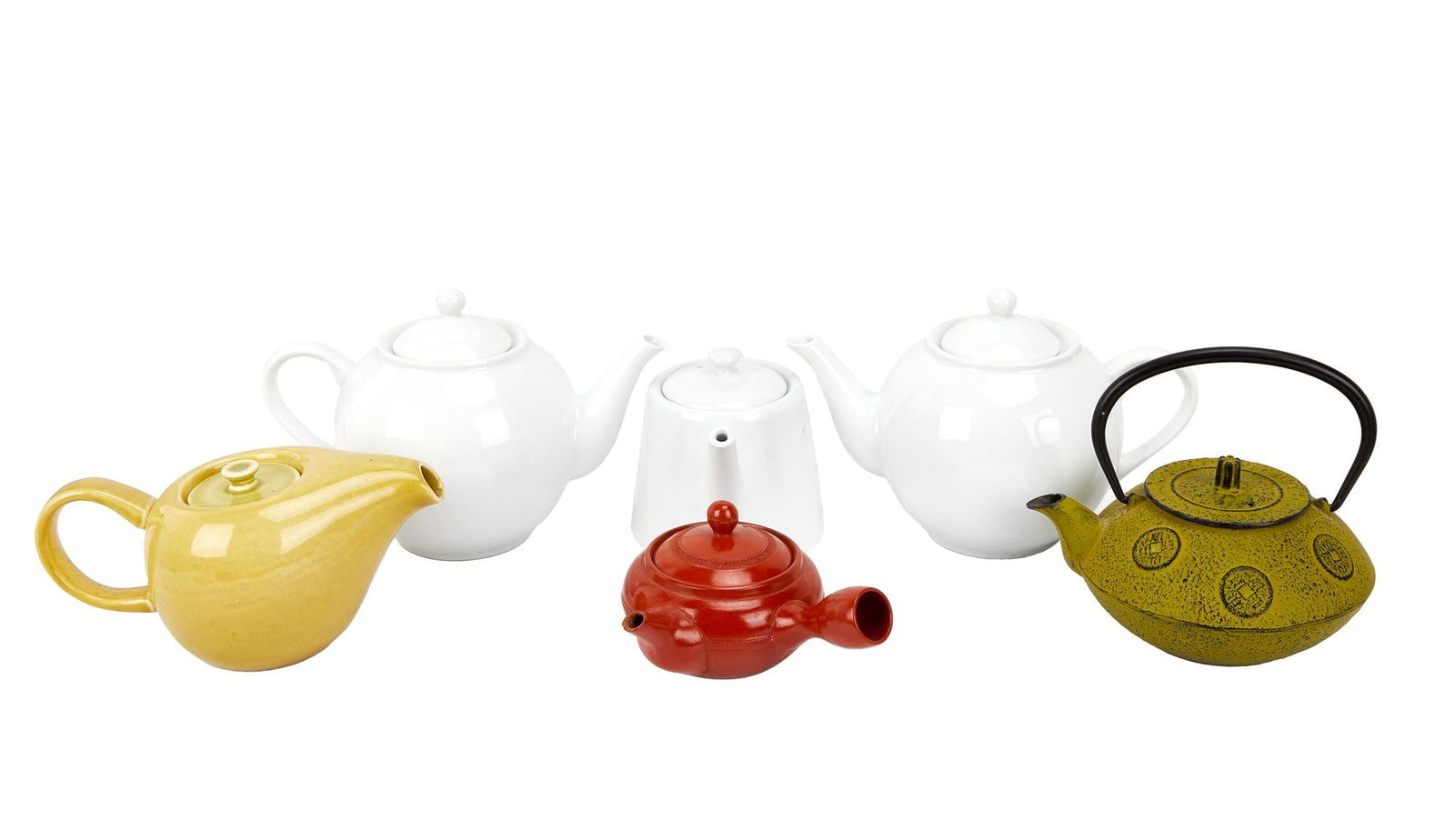 David Lynch | Tea Pots: A group of six including: a pale yellow ceramic one by noted mid-century designer Russel Wright; three white ceramic ones; a terracotta one; and a lime green metal one with an Asian motif. A group of