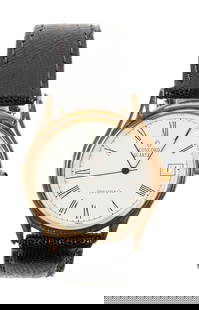 Richard Chamberlain | Vintage Concord Quartz Tiffany & Co. 14K Gold Wristwatch: A vintage 14k gold watch by Concord, retailed by Tiffany & Co, with quartz movement; white circular dial with black Roman numerals, black hands, and window for date; within a 14k gold case; joined