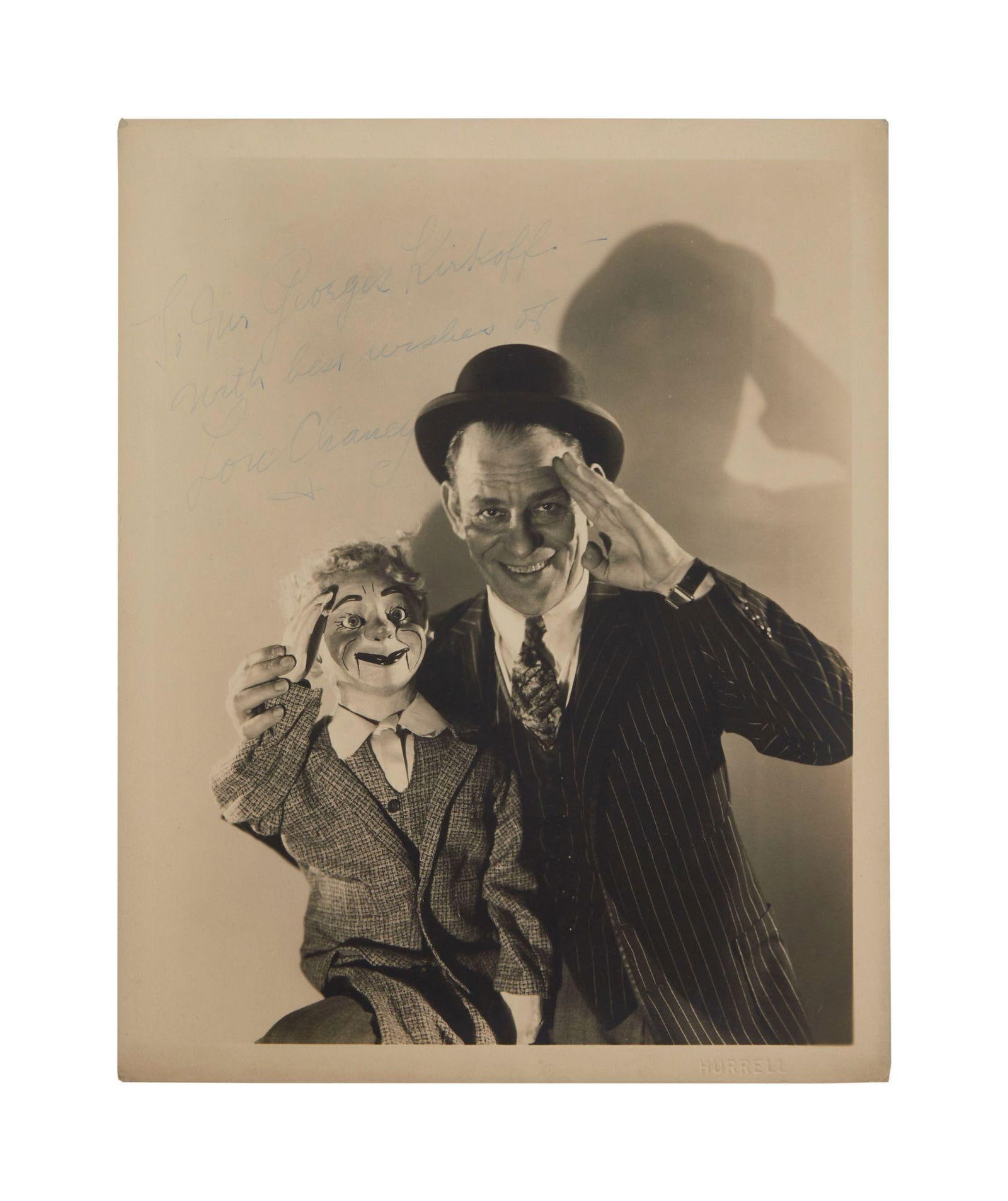 Lon Chaney | 1930 Signed Sepia Photograph by George Hurrell: An original print; matte finish, double-weight paper, depicting the actor in a publicity pose from his 1930 Metro-Goldwyn-Mayer film, "The Unholy Three", signed in blue fountain pen ink in t