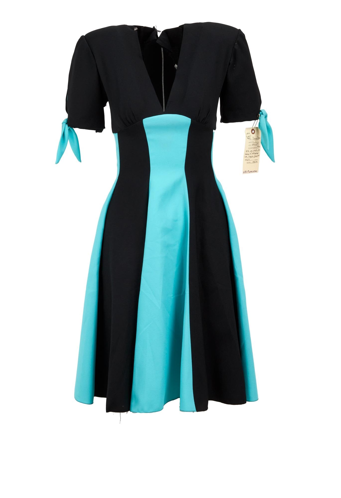Showgirls | Collection of 'Waitress Uniform' Costumes: A group of 10 showgirl waitress uniform-dresses, likely for background dancers, from an unknown production. The costumes are in crepe fabric, with three having sequin embellishments at chest and