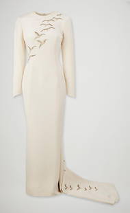 Princess Diana | 1986 Catherine Walker Falcon Evening Gown (With Book): A custom cream silk crepe embroidered evening gown designed by Catherine Walker for Diana, the Princess of Wales, for her 1986 Gulf Tour, including countries Saudi Arabia and the UAE. The gown has a h