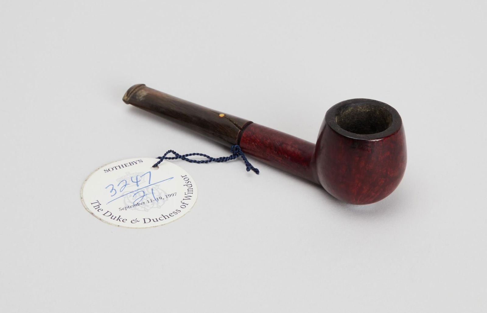 Duke of Windsor | Dunhill London "Made In England" Wooden Pipe: A wooden pipe and pipe head made by Dunhill London, belonging to Edward, the Duke of Windsor. The wooden pipe head had "Dunhill London" carved into the wood as well as "Made in England,