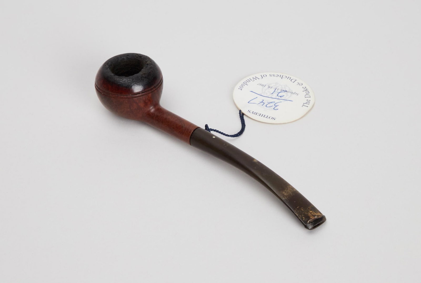 Duke Of Windsor | Sasieni Wooden Pipe: A wooden pipe and pipe head made by Sasieni, belonging to Edward, the Duke of Windsor. The wooden pipe head has "Specialty Selected by Sasieni" carved into the wood as well as "London M