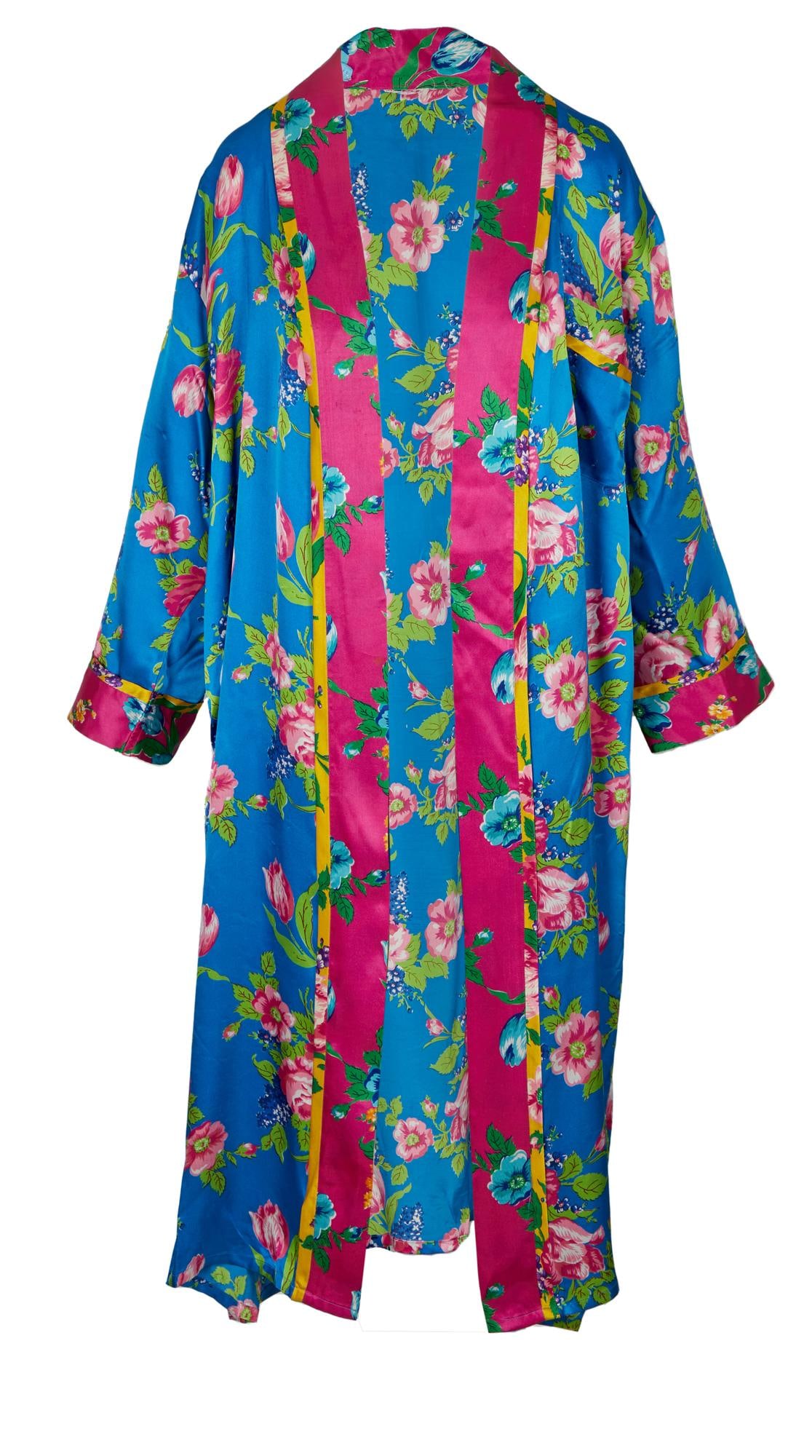 Joan Rivers | Robe Worn in "A Piece of Work": A garment made of satin; with a blue, magenta and lime green floral pattern, floor-length, self-belt missing, no label present. Rivers can be seen wearing the robe backstage at her autobiographical pl