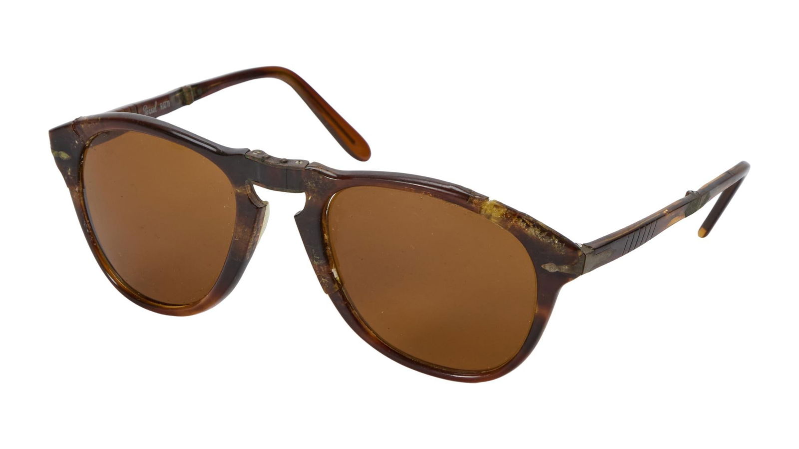 Steve McQueen | Persol Sunglasses: An original pair of tortoise shell folding Persol sunglasses belonging to Steve McQueen. McQueen made this style of sunglasses famous, particularly the original Persol 714 mo