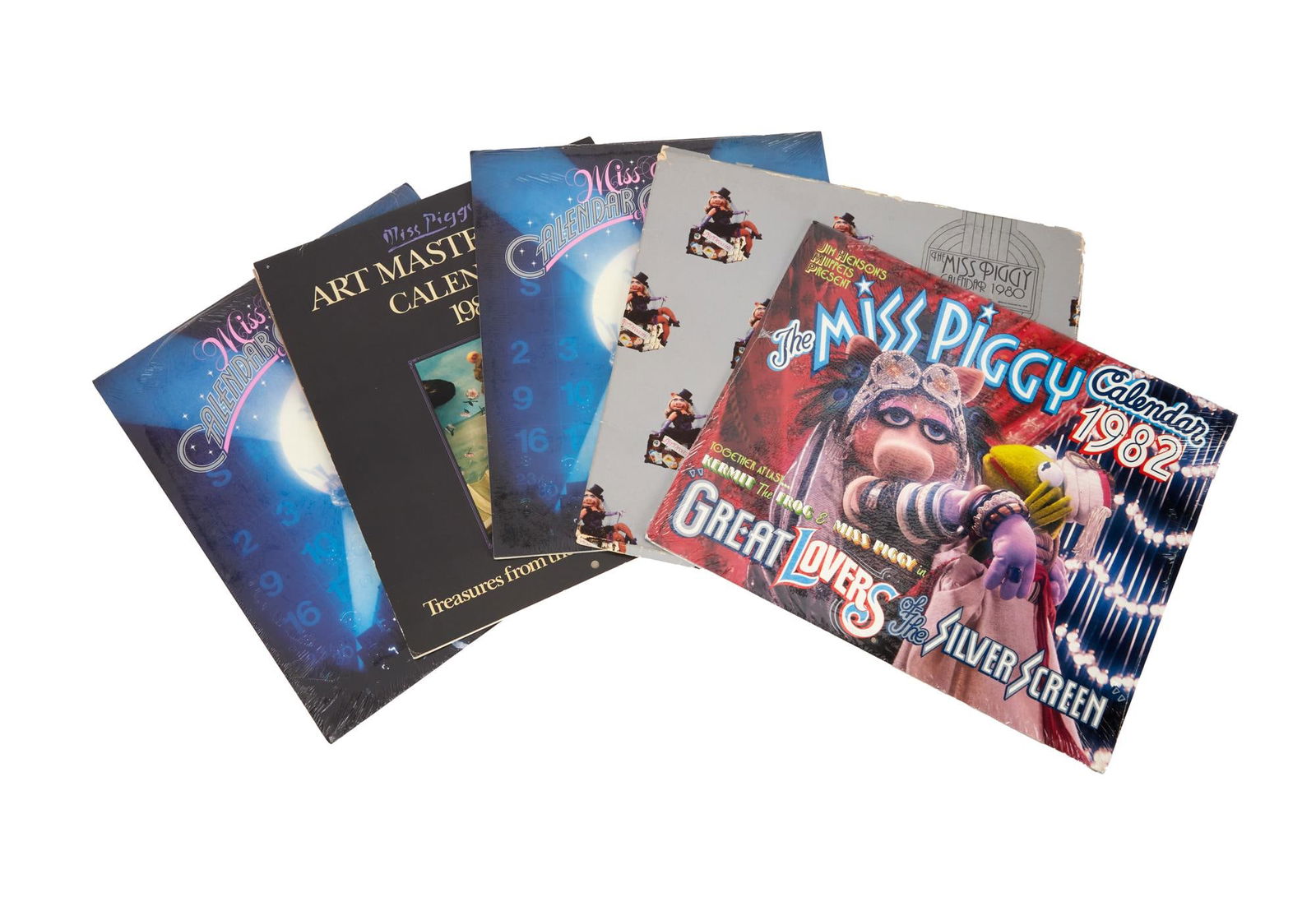 The Muppets | Miss Piggy Calendars: A group of original "Miss Piggy" calendars related to the beloved Muppets character. Included in this grouping is a sealed "The Miss Piggy Calendar" from 1982, two sealed cop