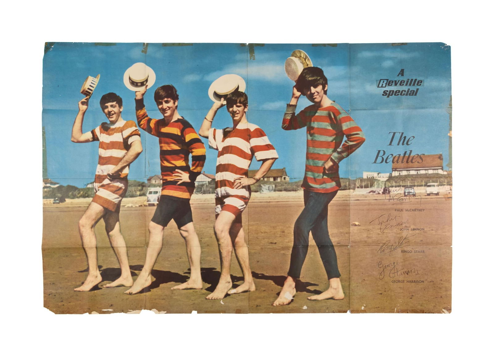 The Beatles | Vintage "The Reveille Special" Poster: A large poster featuring The Beatles on the beach in 1963 photograph by Dezo Hoffman. The poster features printed text that reads "A Reveille Special - The Beatles," as well as the facs