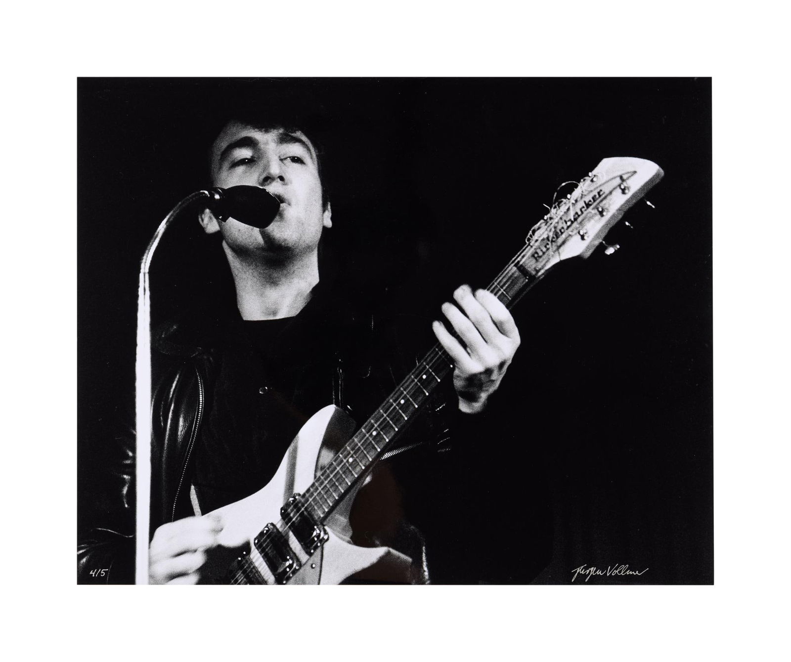 John Lennon | Jurgen Vollmer Signed Photo: An original black and white photograph of John Lennon performing live at the Top Ten Club, Hamburg, Germany in 1961, taken by Jurgen Vollmer and signed and numbered by him in silver marker. 16 x 20 in