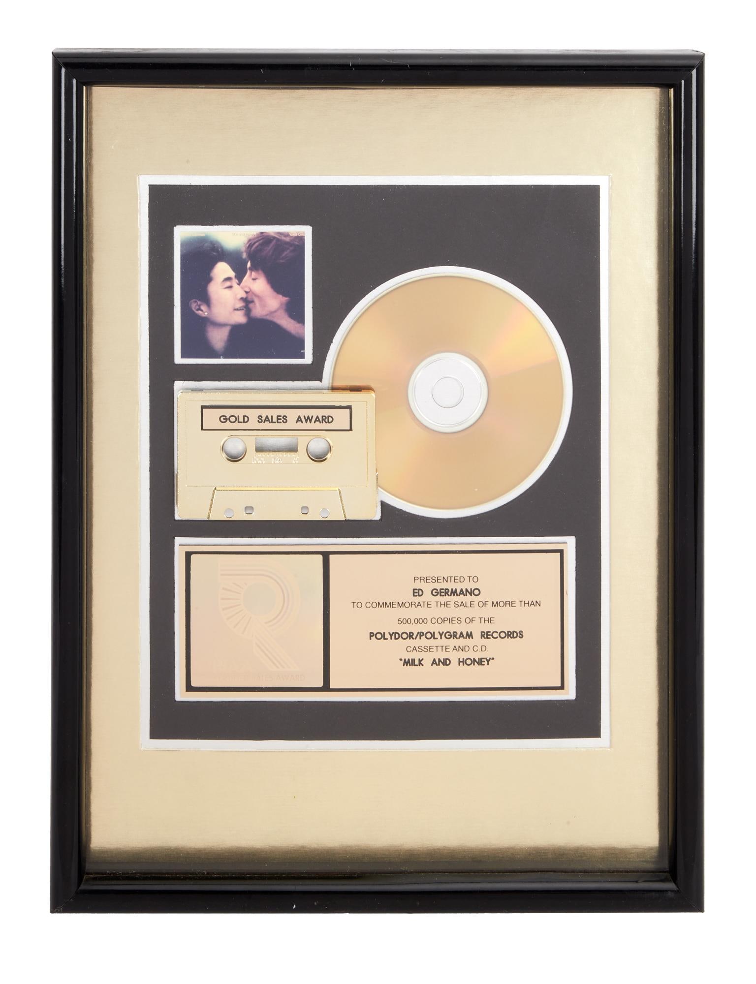 John Lennon and Yoko Ono | 1984 Edward Germano "Milk and Honey" RIAA Gold Sales Award: A 1984 RIAA gold CD and cassette sales award presented to Edward Germano (owner of the Hit Factory) for the sale of over 500,000 copies of John Lennon and Yoko Ono's album, Milk and Honey. Accompa