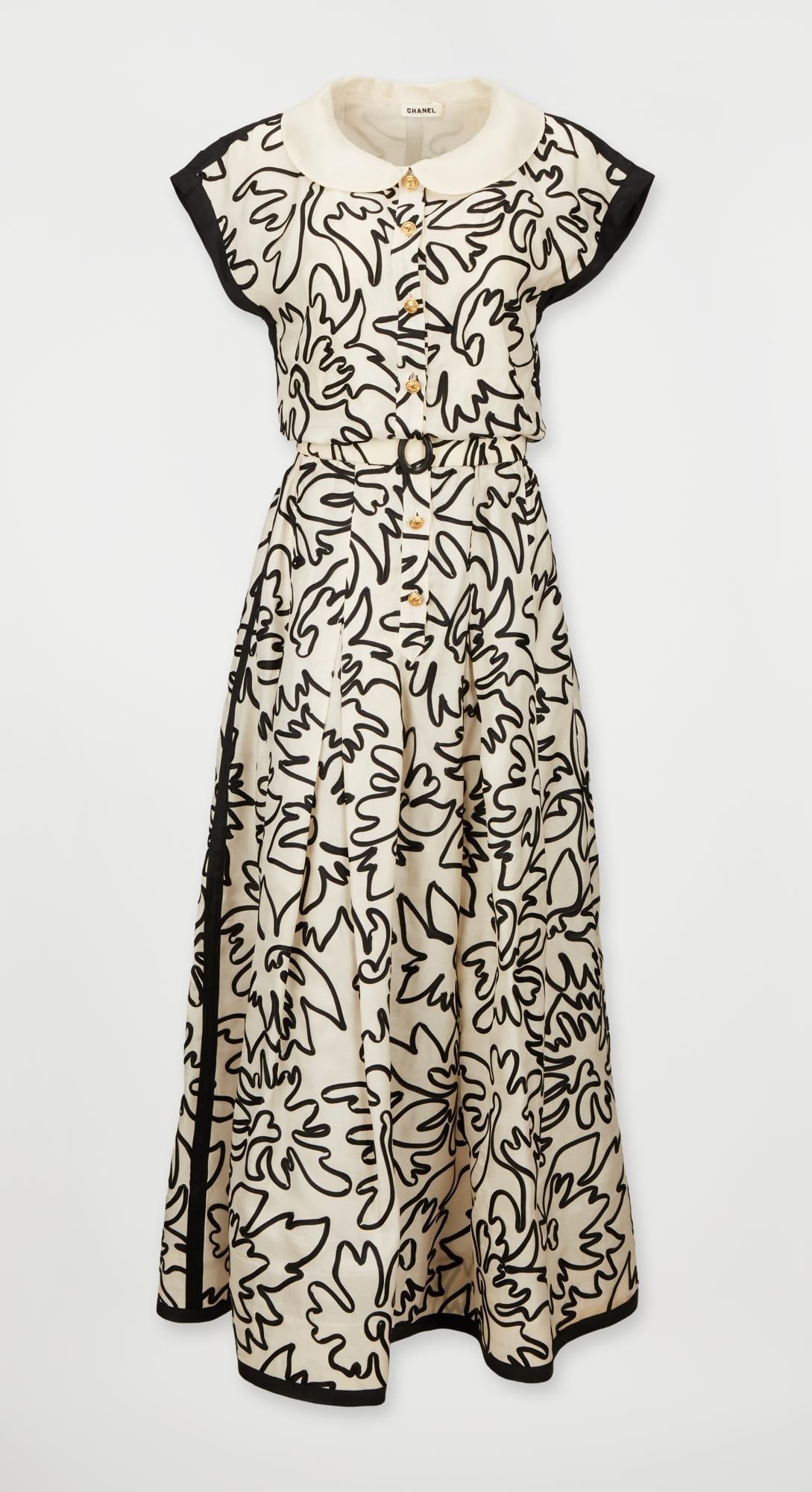 Chanel | Patterned Soutache Embroidered Demi-Couture Gown: A Chanel demi-couture floor-length gown featuring black soutache embroidery in an abstract pattern, the year unknown, but likely from the 1970s. The gown features a tailored bodice with a peter-pan co