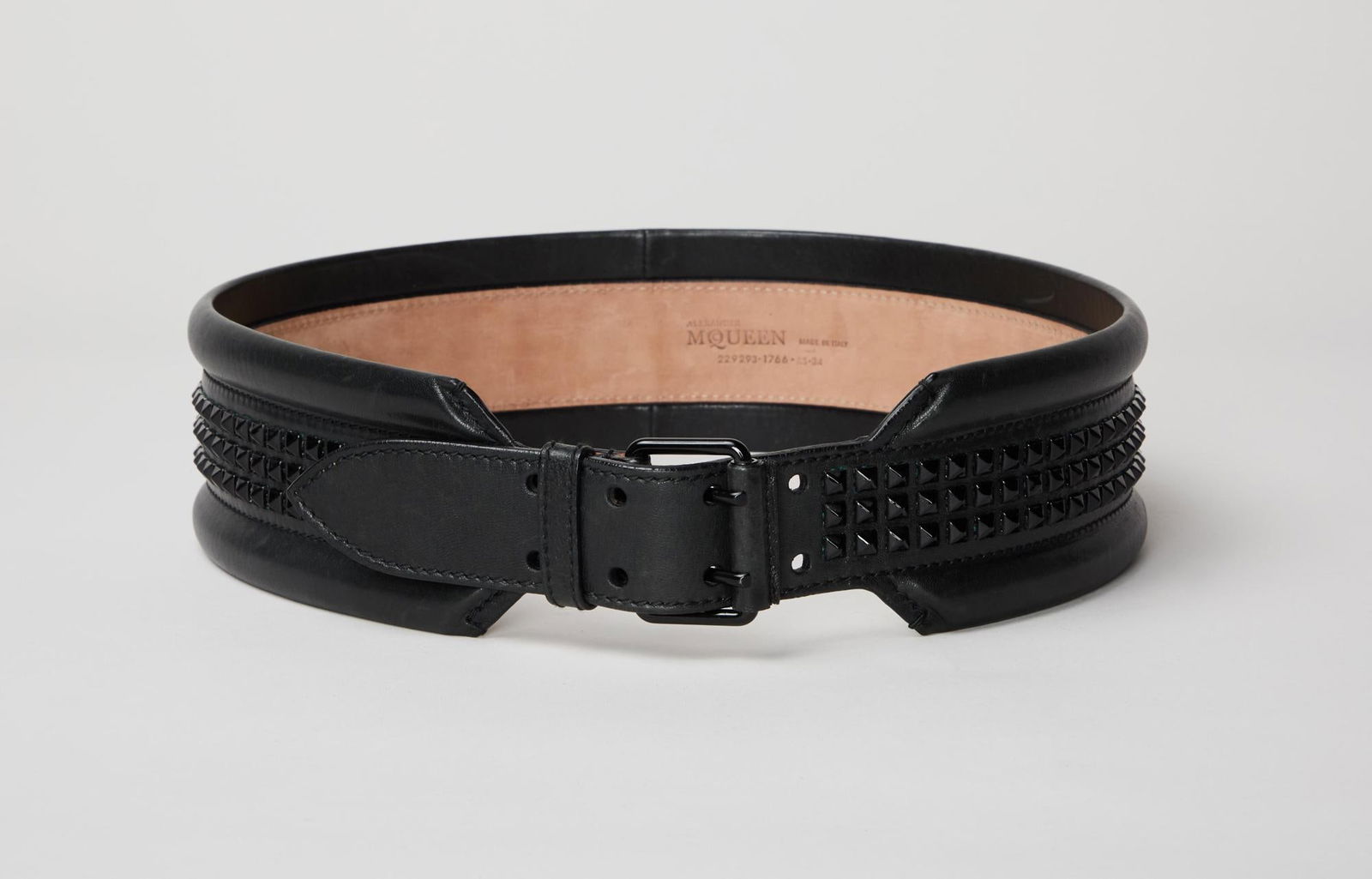 Alexander McQueen | Leather Belt with Studwork: An Alexander McQueen black smooth leather belt with black enamel studwork and buckle. The belt is worn at the natural waistline, the interior side of the belt is natural suede embossed with Alexander