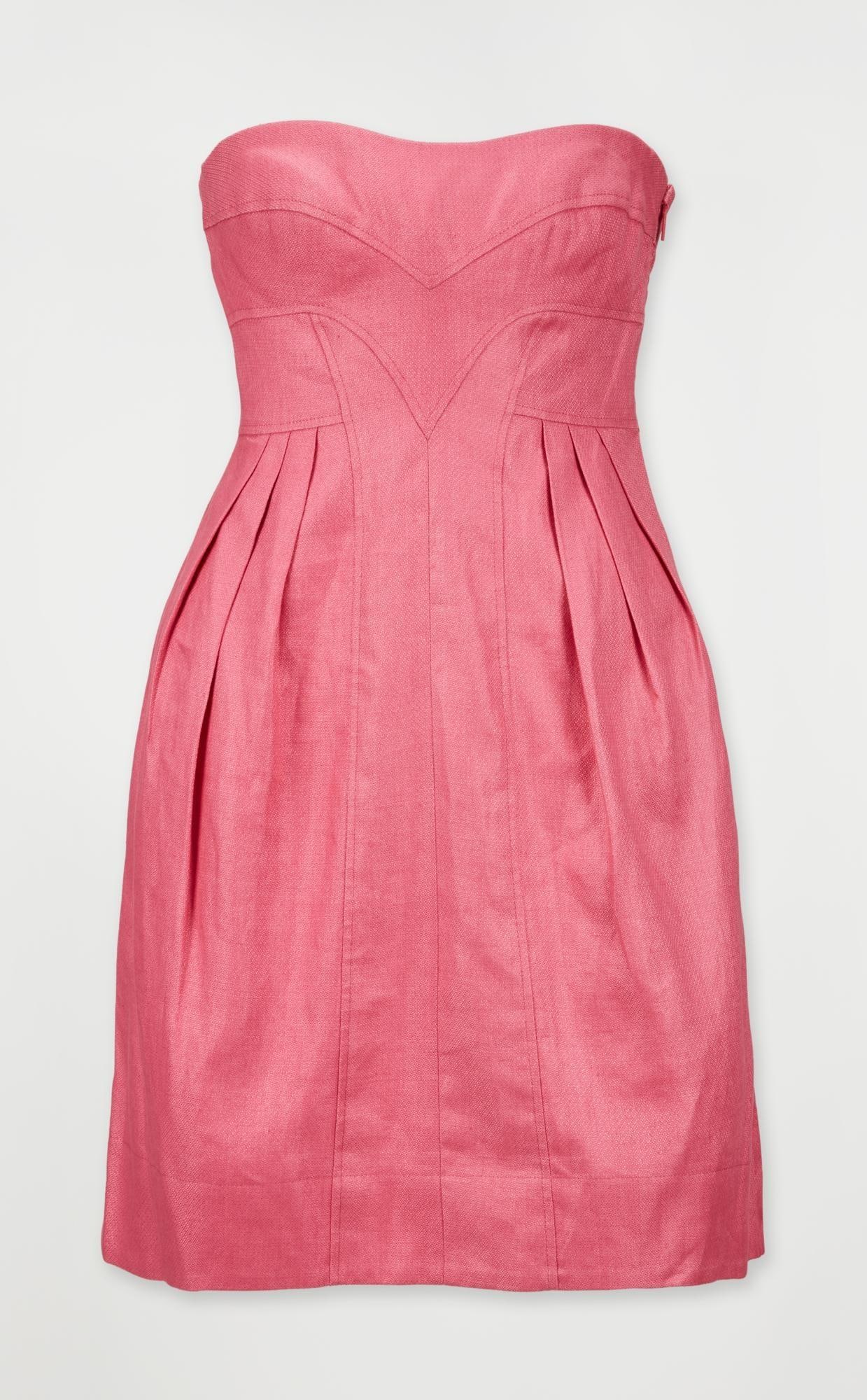 Versace | Pink Cocktail Dress: A bubble-gum pink strapless linen babydoll dress with an empire waistline and bubble skirt designed during Donatella Versace's tenure as creative director. The dress has an internal construction t