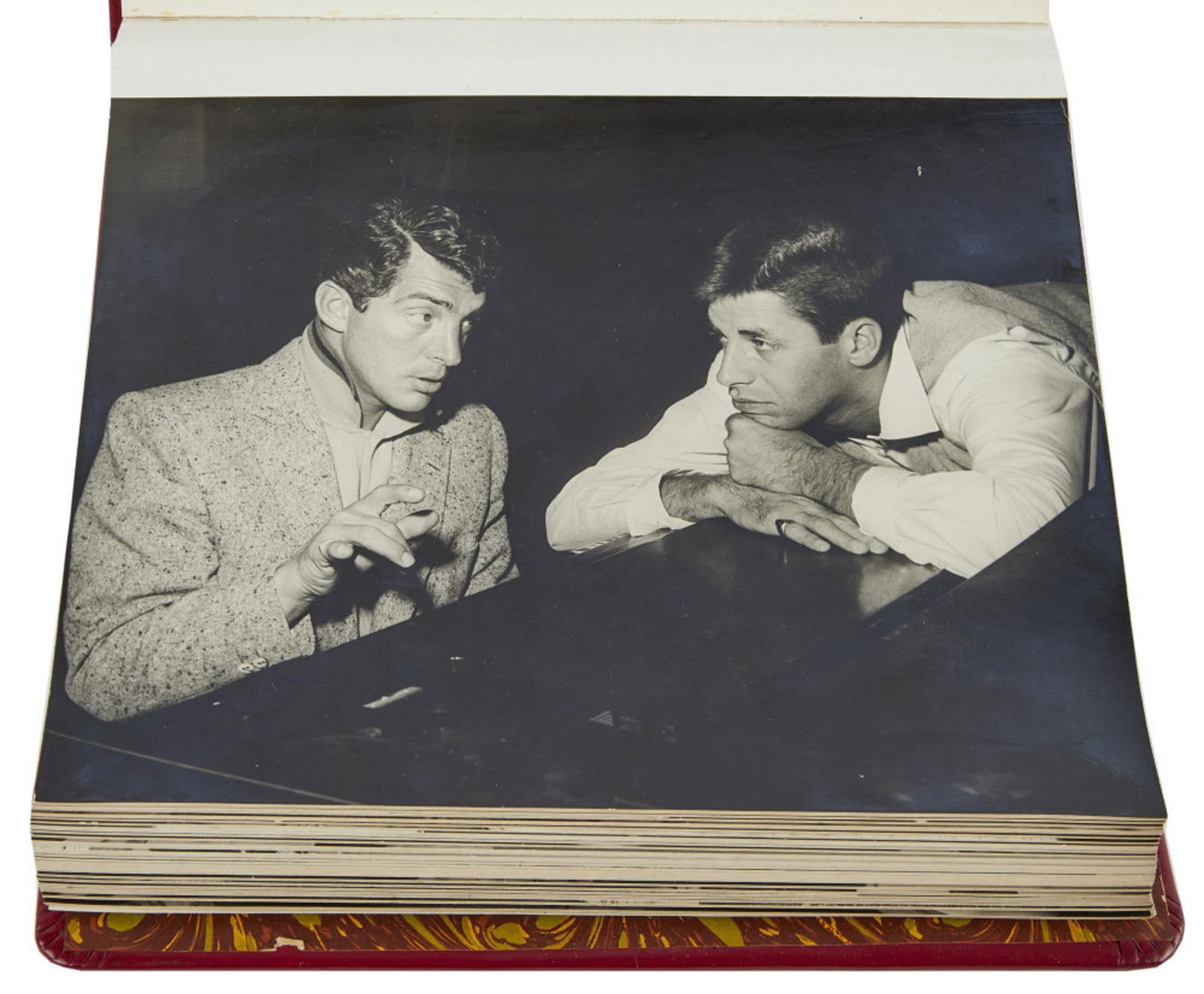 Jerry Lewis | 1953 Rare Photo Album from "The Colgate Comedy Hour": NBC Television, 1950-1955; a red leather album, embossed in gold on the cover in part "Martin & Lewis / TV Rehearsal / for/ May 3, 1953 Show" and "Jerry Lewis," filled with 27