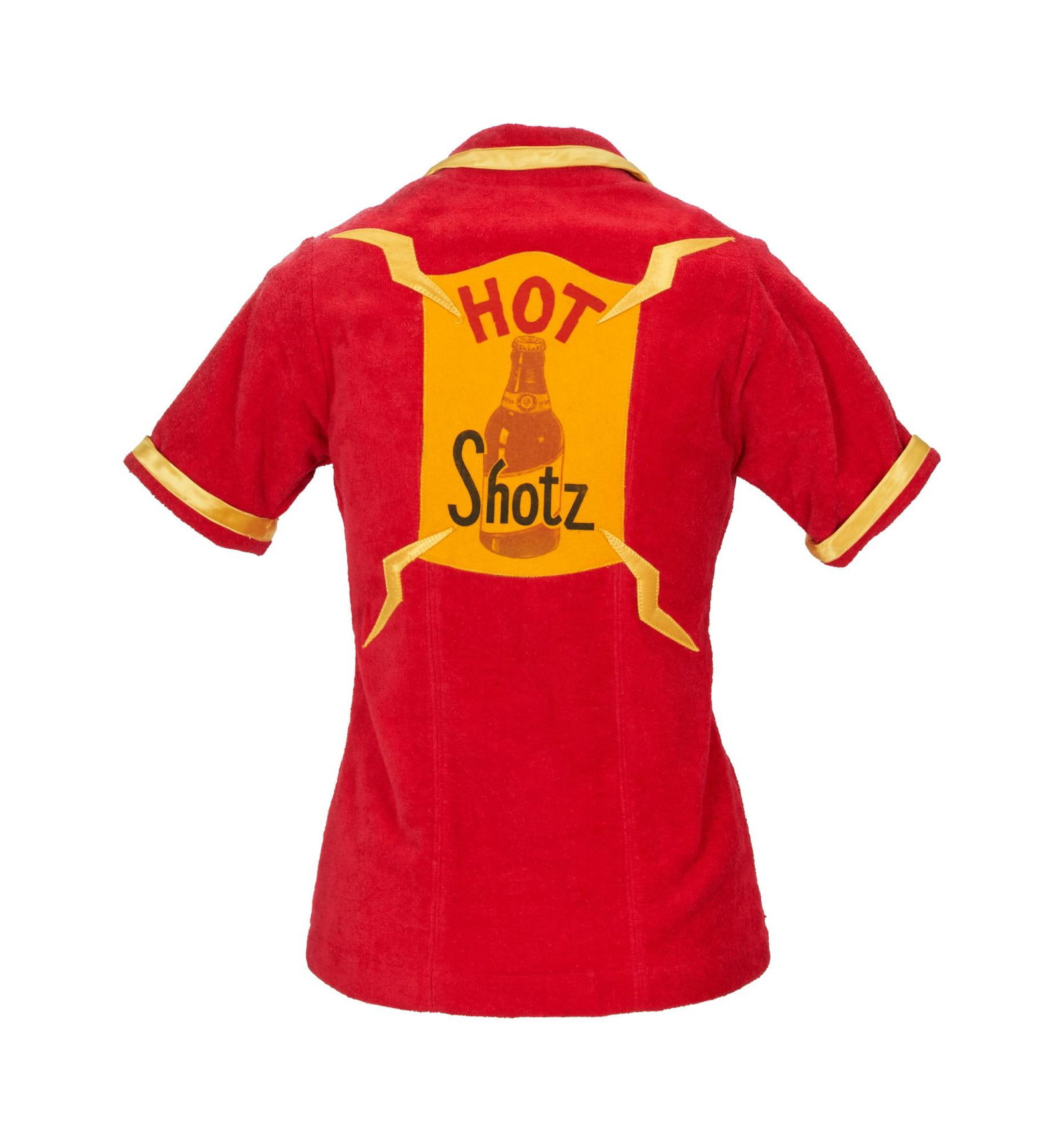 Cindy Williams | 1970s Top from "Laverne & Shirley": ABC Television, 1976-1983; a garment made of red terry cloth with yellow "lightning bolt" details, short sleeves, yellow satin trim on lapels, back with a yellow felt patch reading "Hot